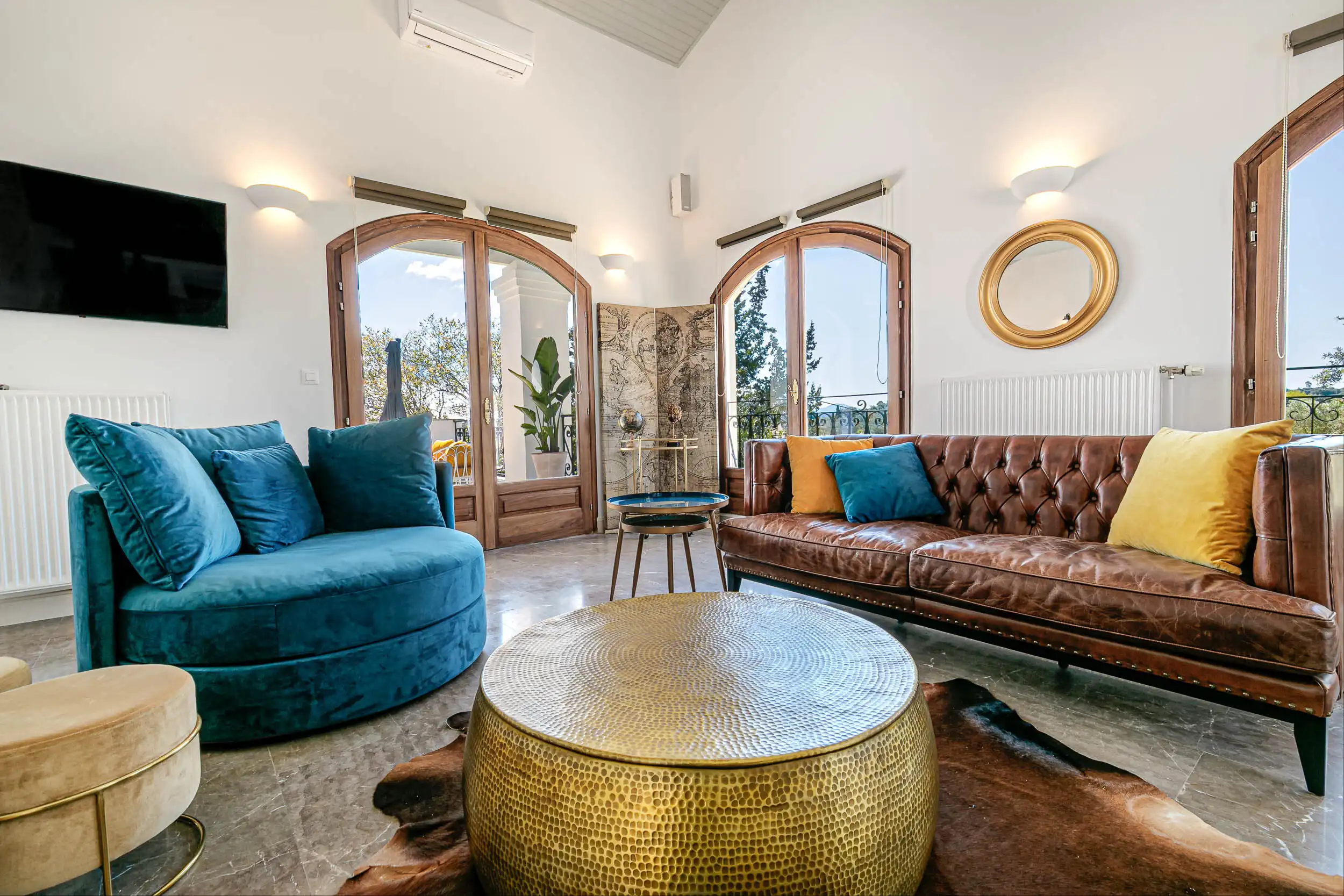 Luxury 6-Bedroom Sea-View Villa for Sale in Gouvia, Corfu – Fully Renovated & Minutes from Marina Elegant living room with sea views, stylish furniture, and modern decor in a renovated villa in Gouv.
