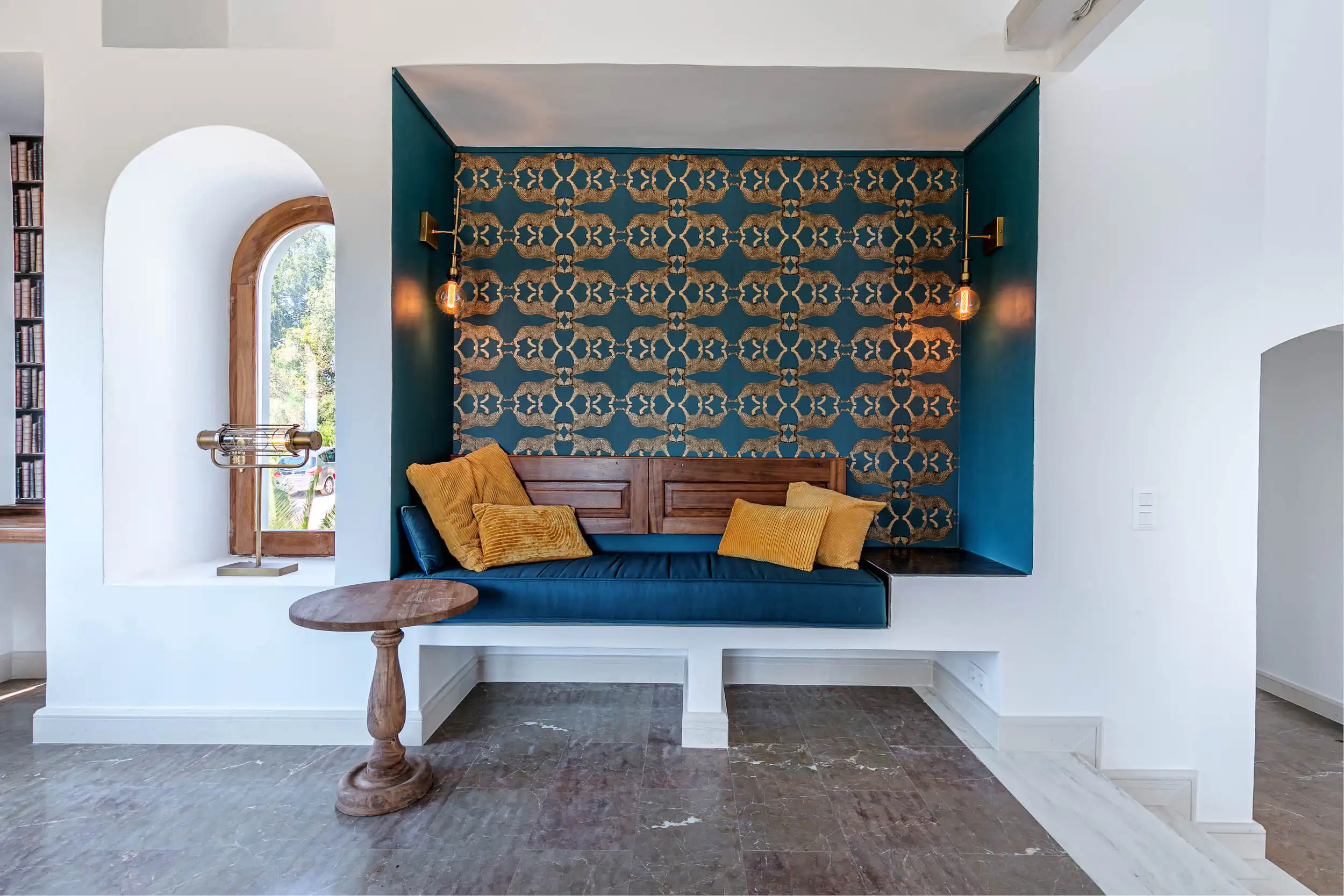 View Villa Interior View Villa Lounge with Built-in Seating and Decorative Wall.