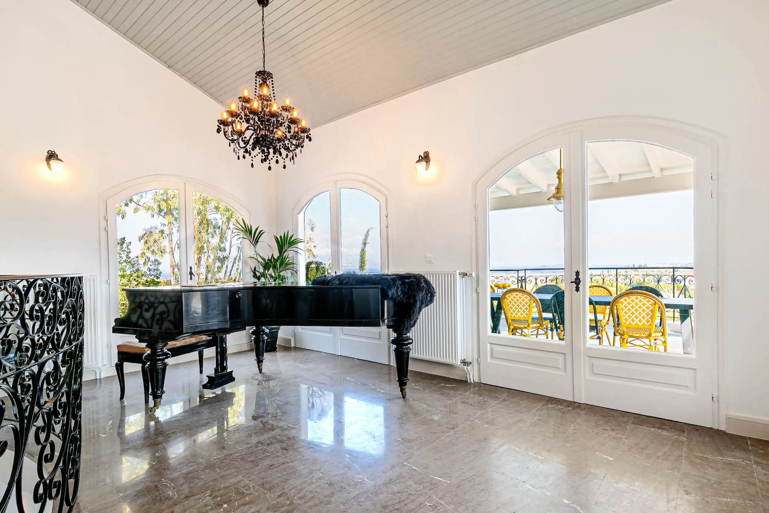 Luxury 6-Bedroom Sea-View Villa in Gouvia, Corfu View living room with large windows and elegant decor.