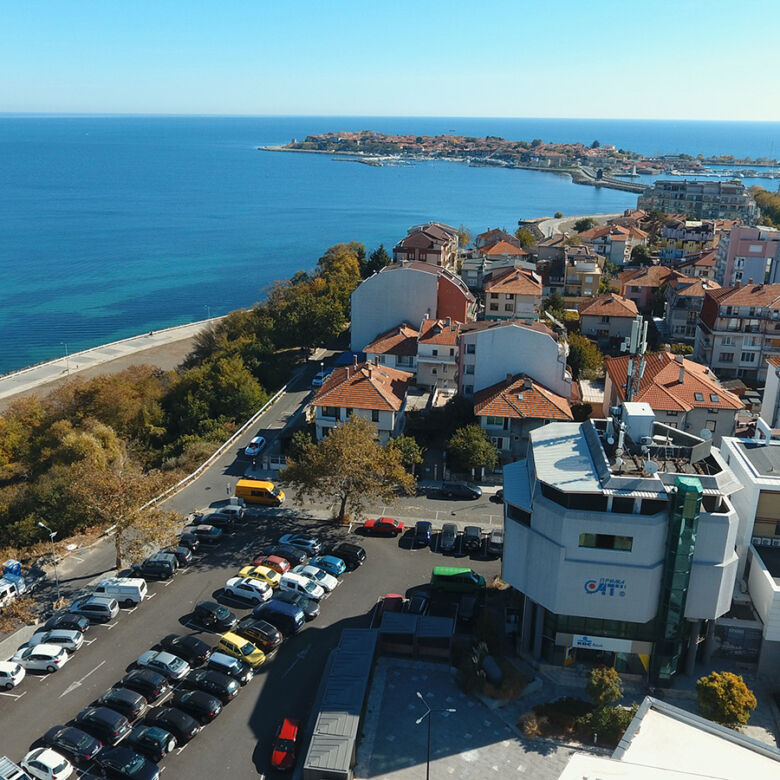 Modern PrimeSat building complex overlooking Nessebar coast and sea.