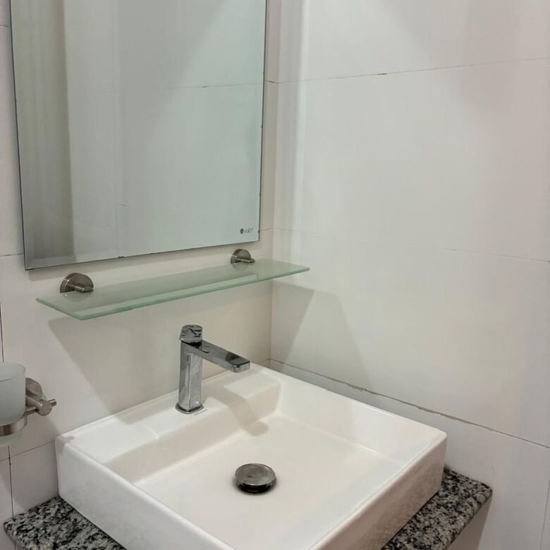Bathroom sink with mirror in Waikkal estate.