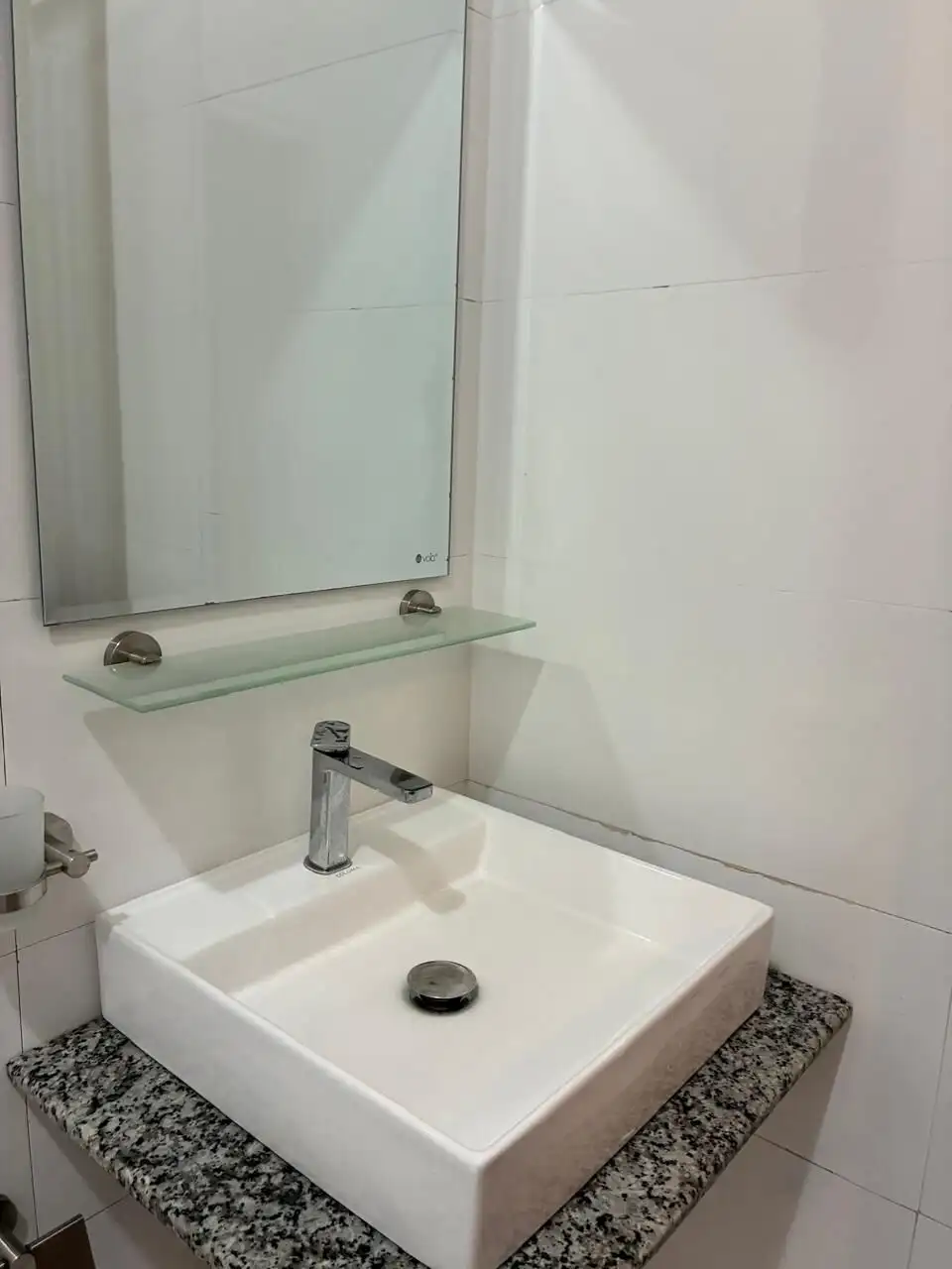 Bathroom sink with mirror in Waikkal estate.