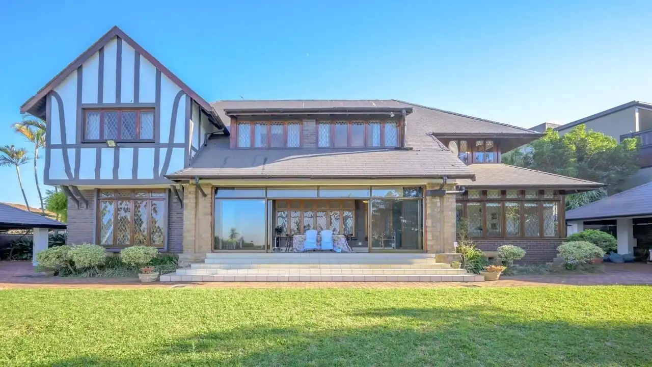 Elegant 9-bedroom estate in Durban with spacious living areas and beautiful garden views. Perfect fo.