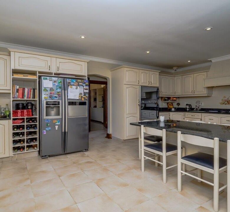 Spacious kitchen of a luxury 9-bedroom estate in Durban South, featuring modern appliances and ample.