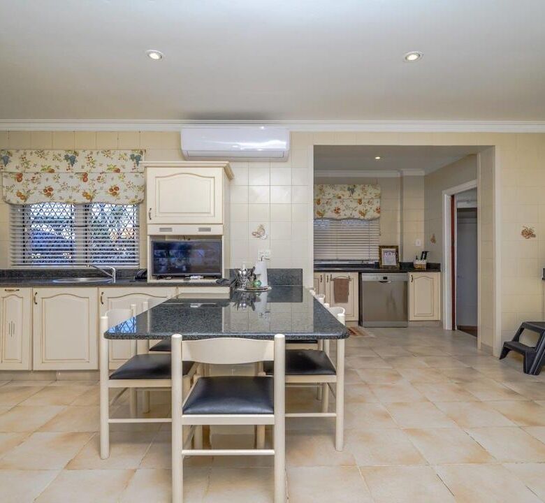 Spacious kitchen with modern appliances in a luxurious Durban estate. Perfect for family living and.