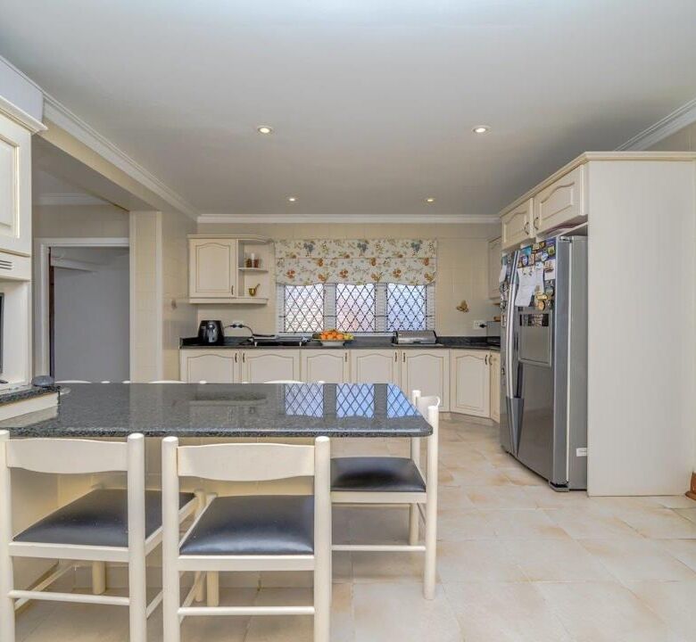 Spacious kitchen with modern appliances in a luxurious Durban estate for sale.