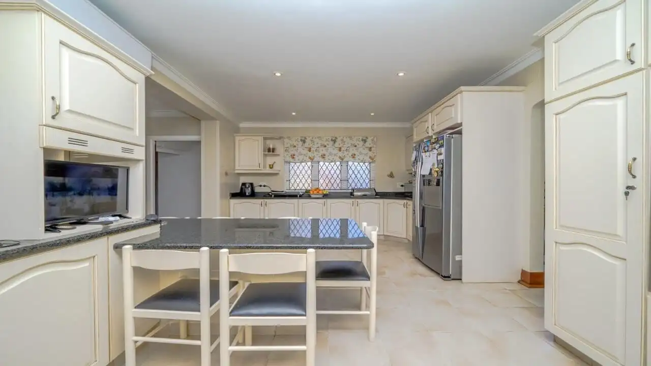 Spacious kitchen with modern appliances in a luxurious Durban estate for sale.