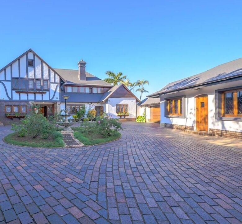 Spacious 9-bedroom estate for sale in Durban South with lush gardens and elegant architecture.