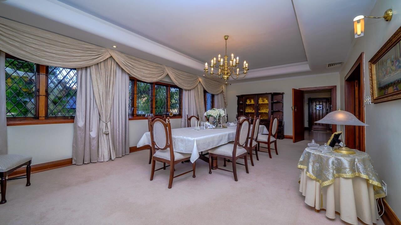 Luxury 9-Bed Estate Dining Room Elegant dining room in a luxury 9-bedroom estate in Durban South. Features classic decor, large wind.