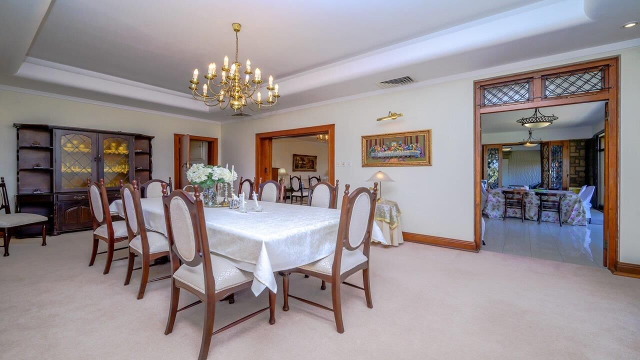 Luxury Durban Estate Dining Room Elegant dining room in a luxury Durban estate with a large table and classic decor.