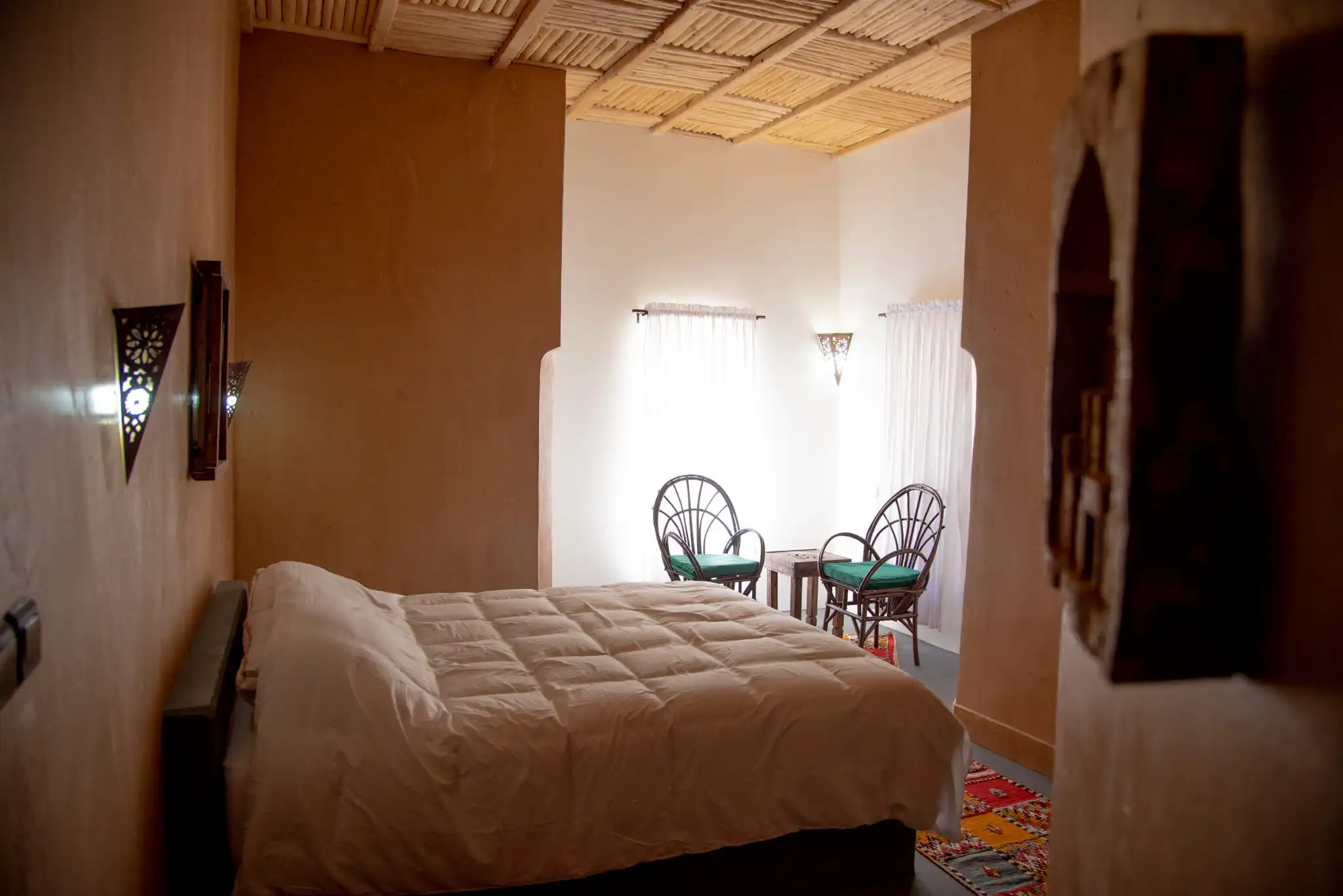 Beautiful interior of Kasbah Tiziri Hotel in Imzough, showcasing traditional Moroccan decor and cozy.