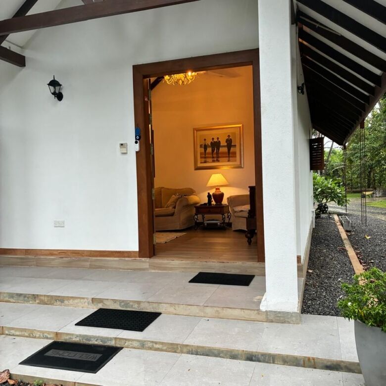 Beautiful entrance of a two-house estate in Waikkal, Sri Lanka, showcasing modern architecture and l.