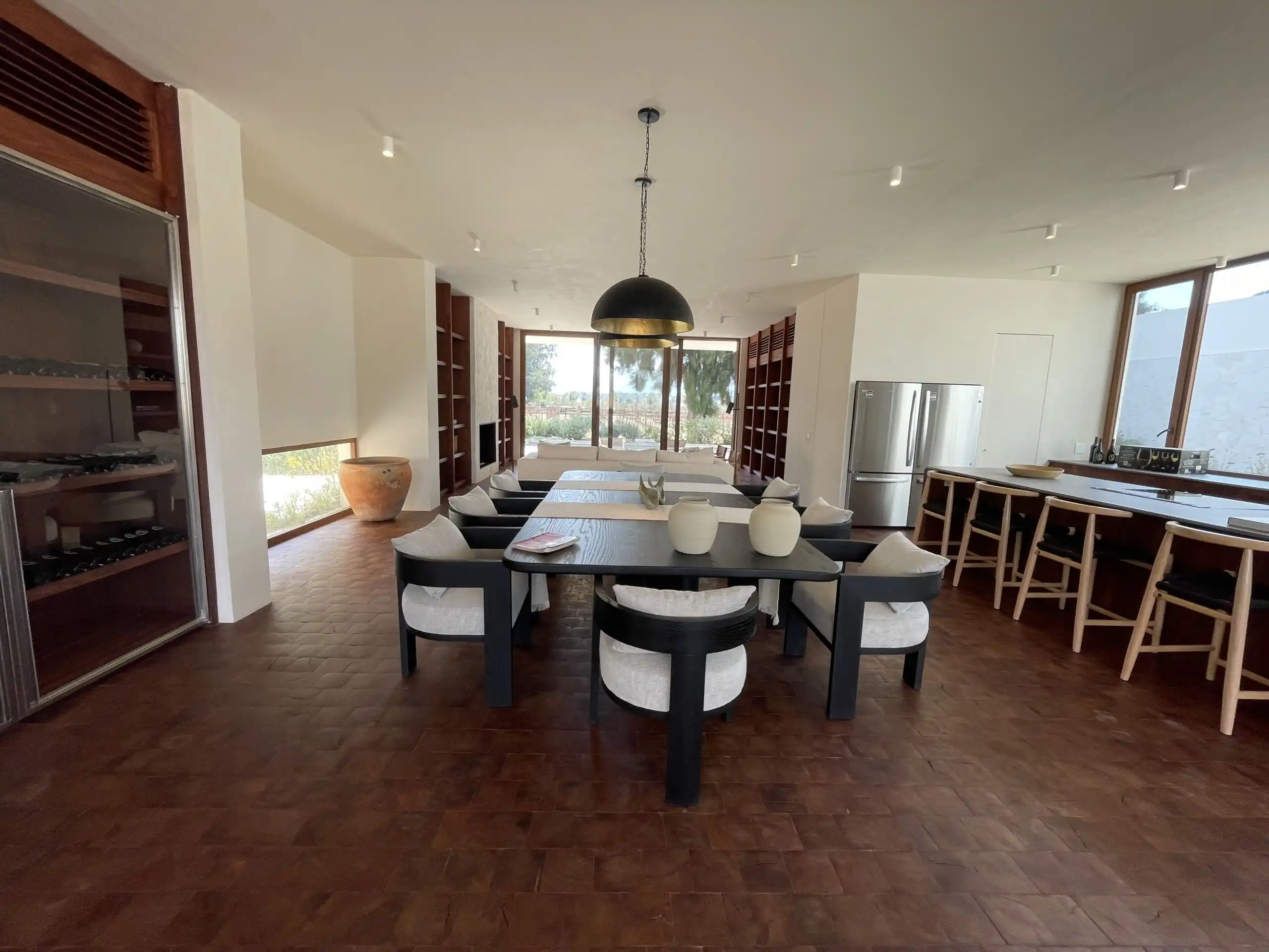 Luxury Vineyard Dining Room Elegant dining area with modern decor and panoramic vineyard views in San Miguel de Allende.