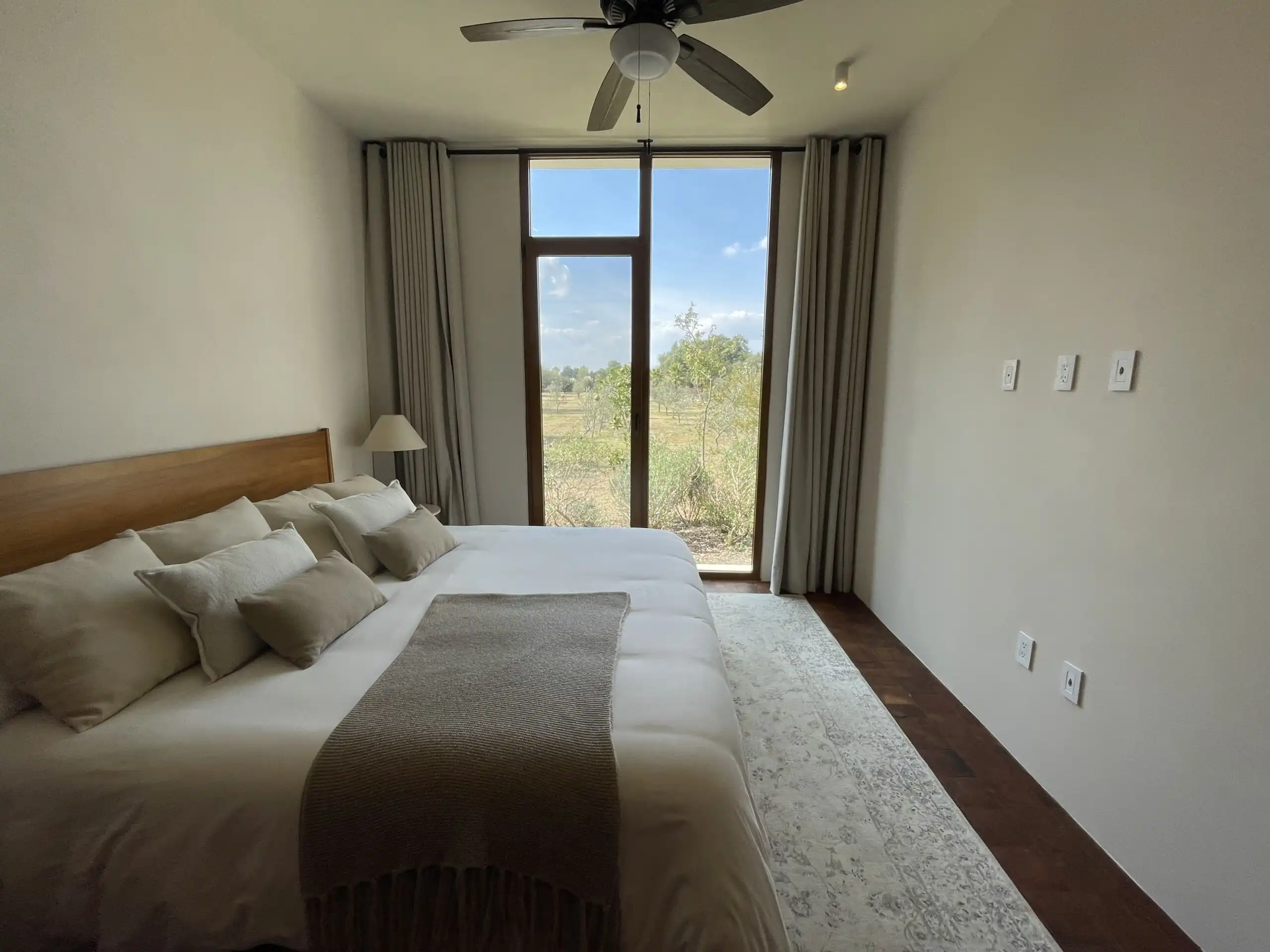 Luxury Vineyard Bedroom in San Miguel de Allende Bright bedroom with large window overlooking vineyards in San Miguel de Allende. Modern decor and na.