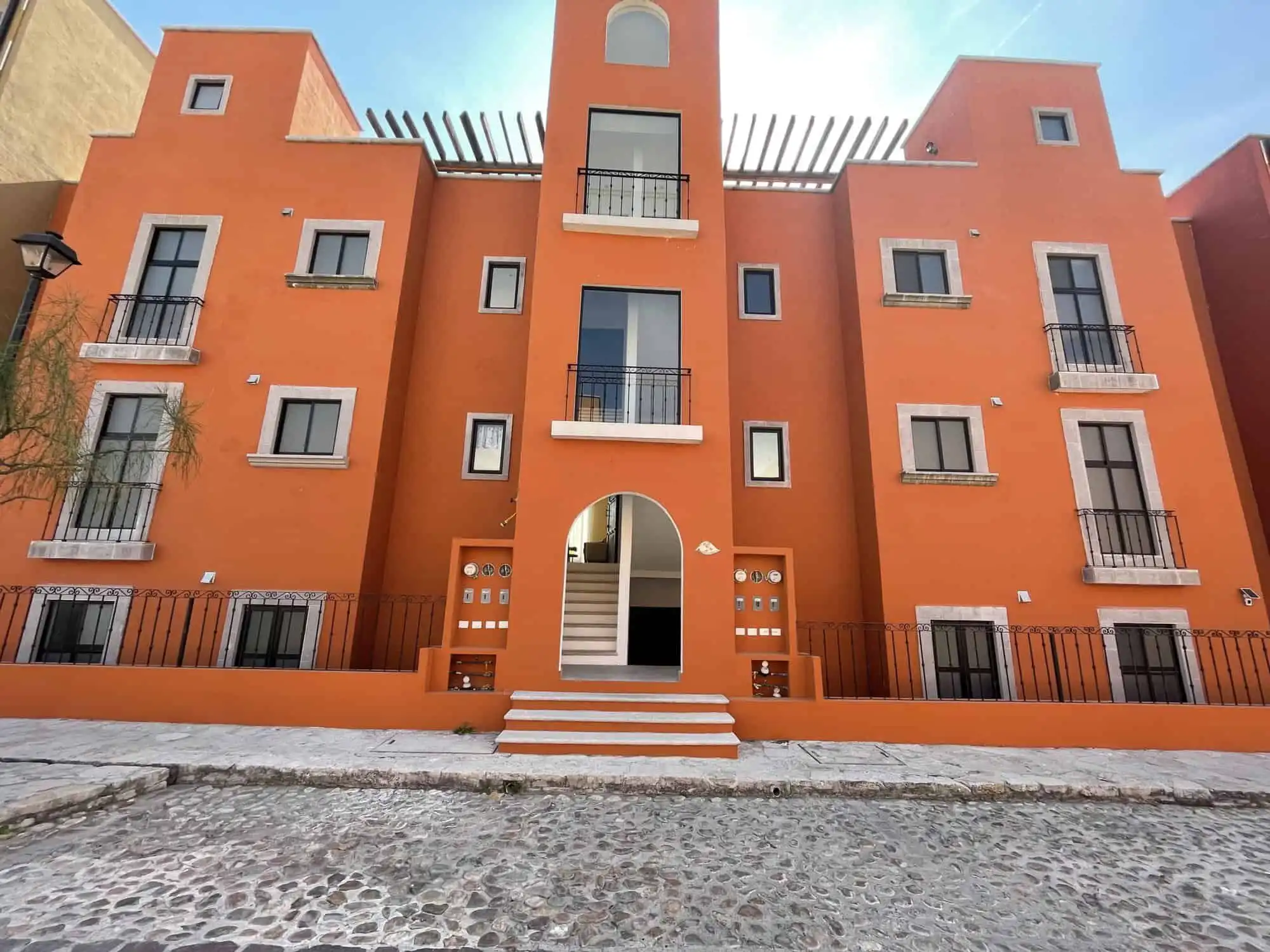 Charming 2-bedroom home in San Miguel de Allende, Mexico, with vibrant exterior and modern design.