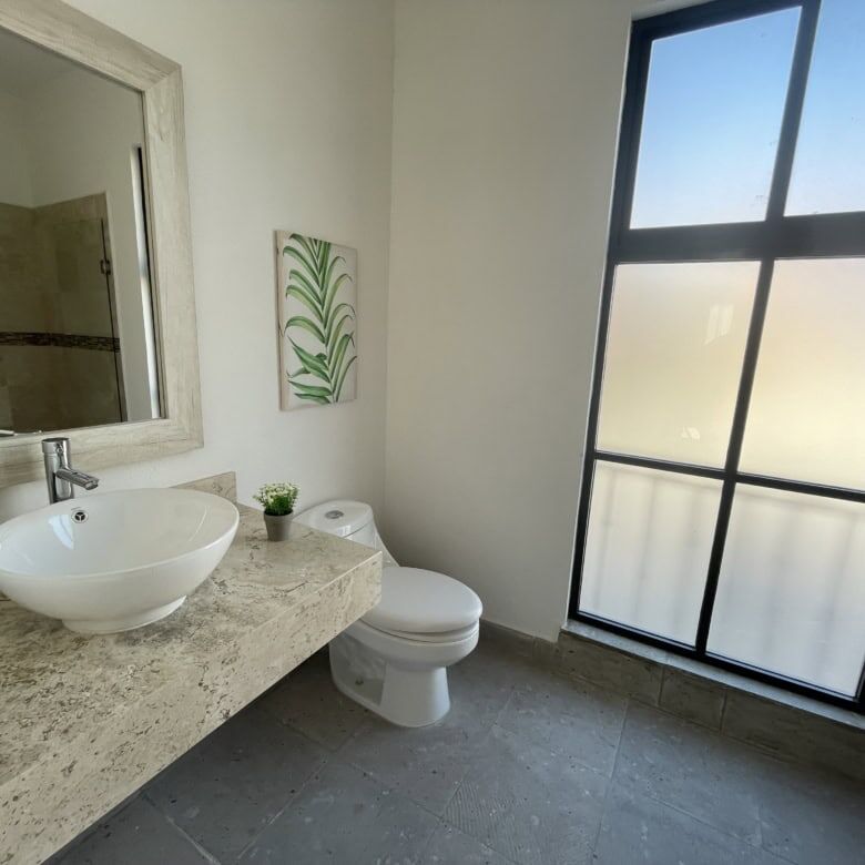 Bright bathroom with contemporary fixtures and natural light.