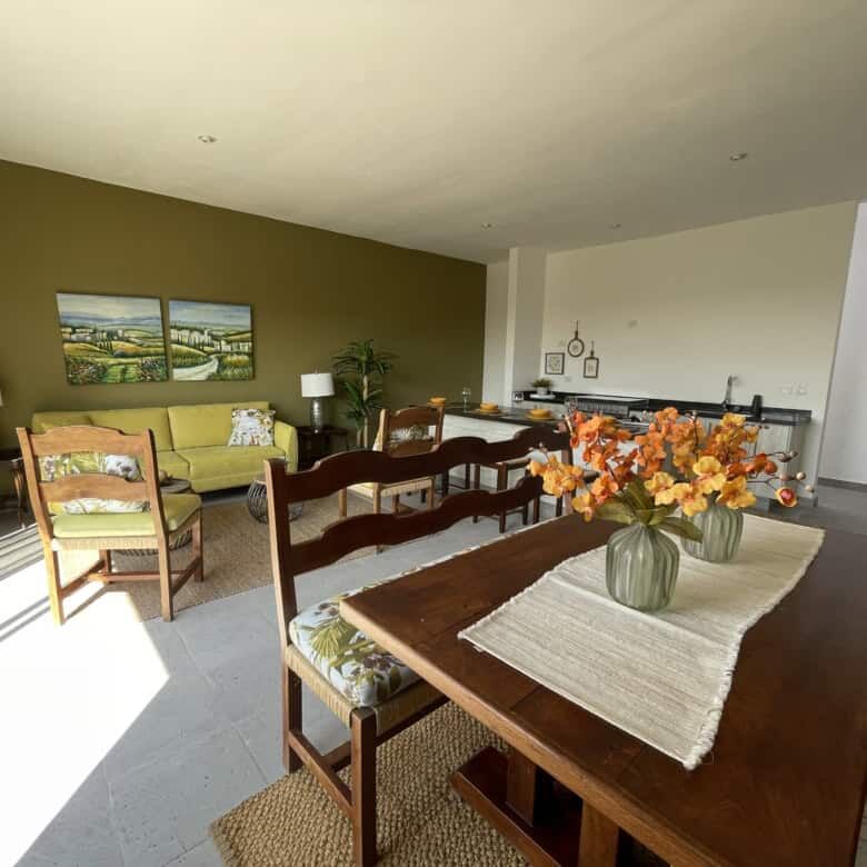 Spacious living room with contemporary decor, wooden furniture, and natural light in Santo Domingo h.