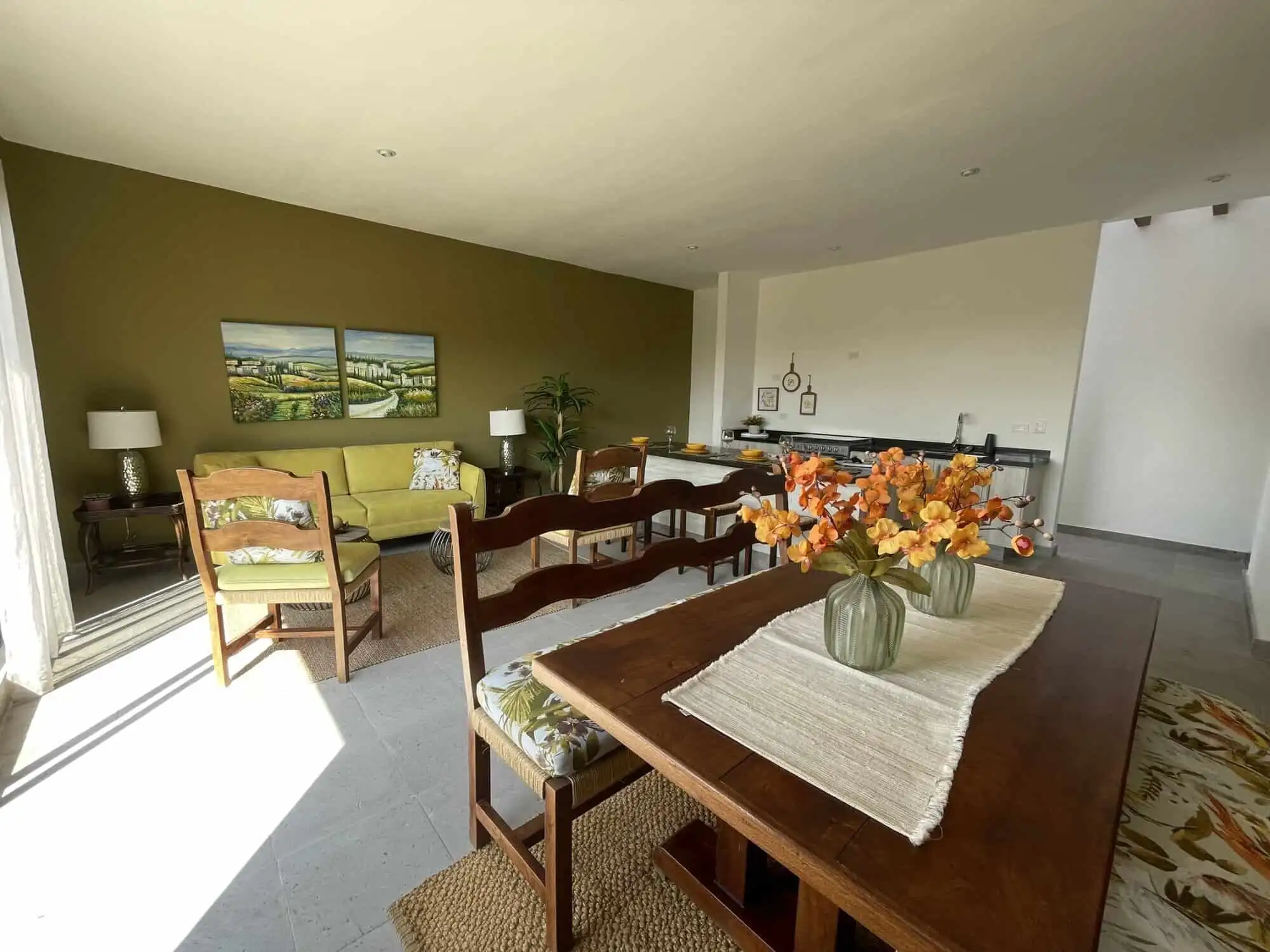 Spacious living room with contemporary decor, wooden furniture, and natural light in Santo Domingo h.