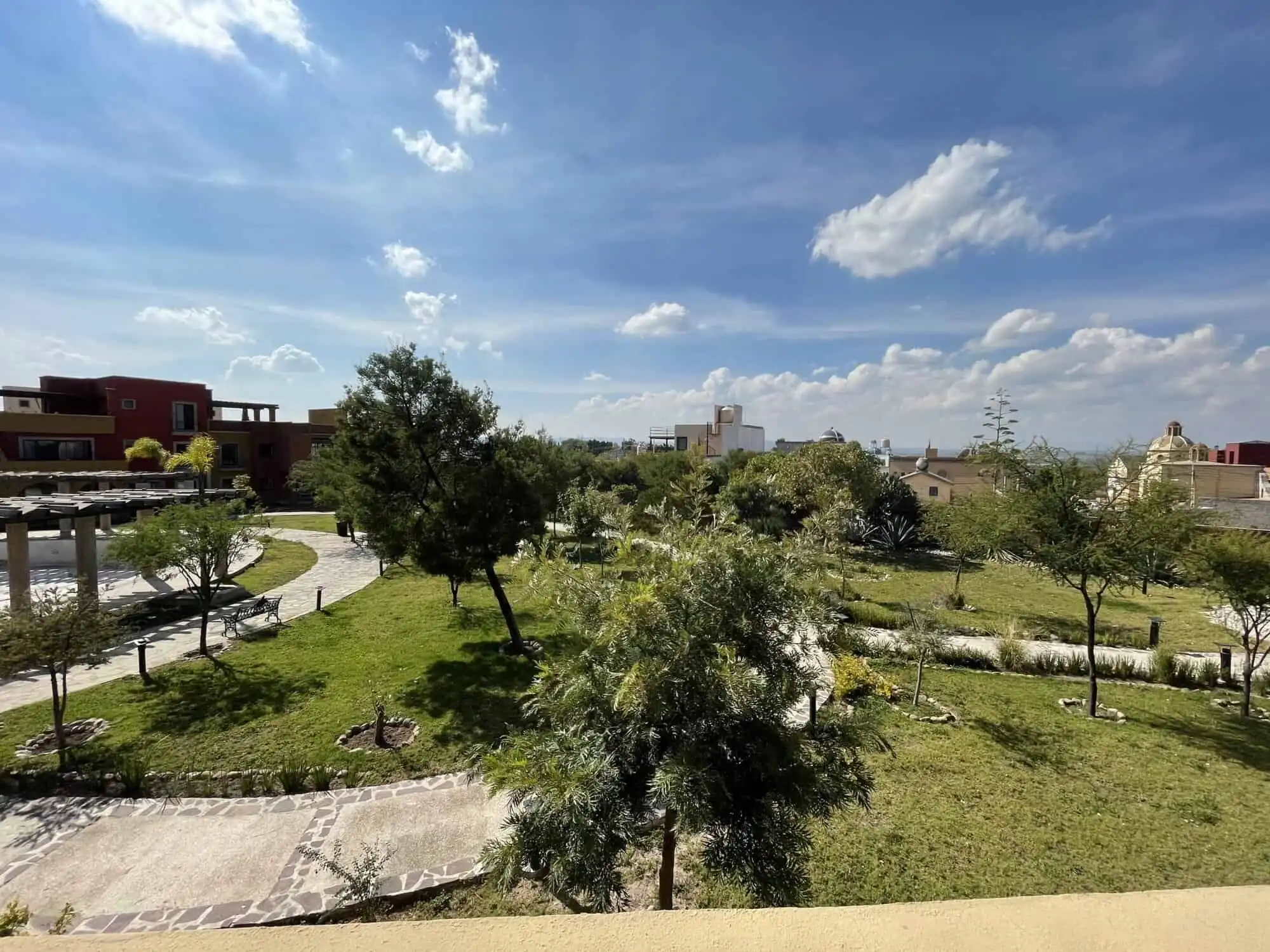 Beautiful view of lush green gardens and trees at Santo Domingo home tour.