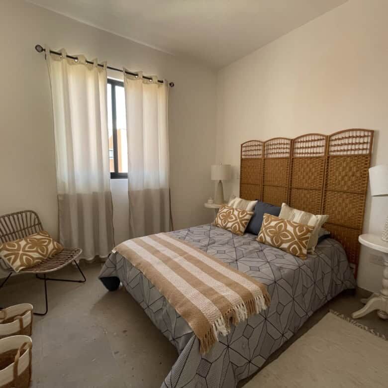 Bright bedroom with stylish decor and natural light in Santo Domingo home.