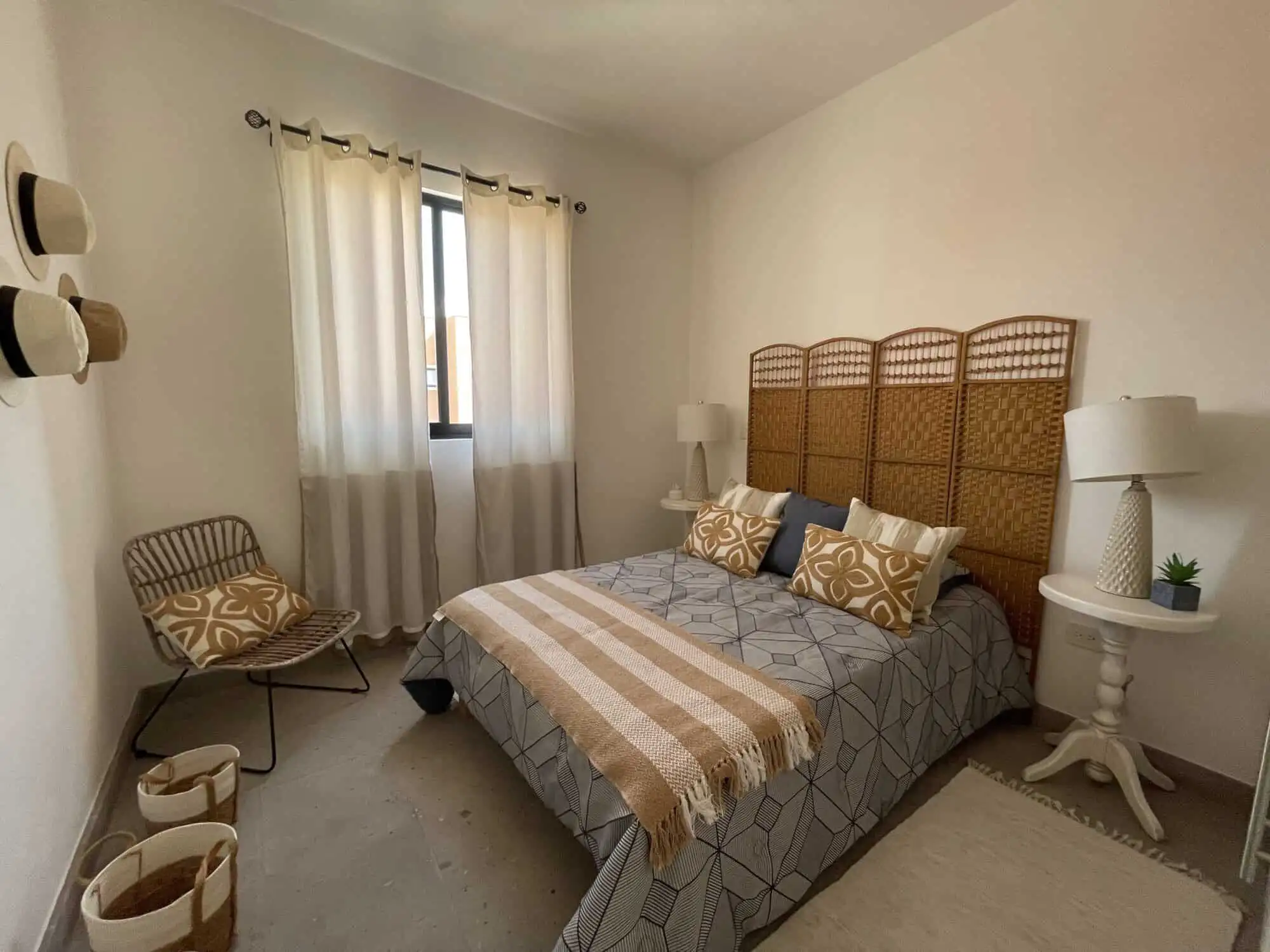 Bright bedroom with stylish decor and natural light in Santo Domingo home.
