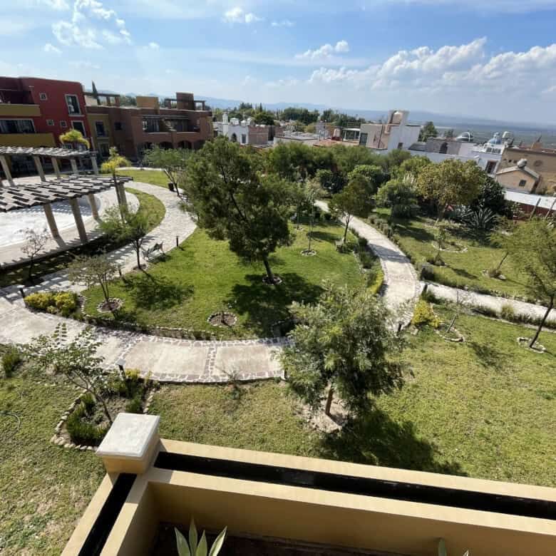Beautiful garden with walking paths and lush greenery in Santo Domingo home.