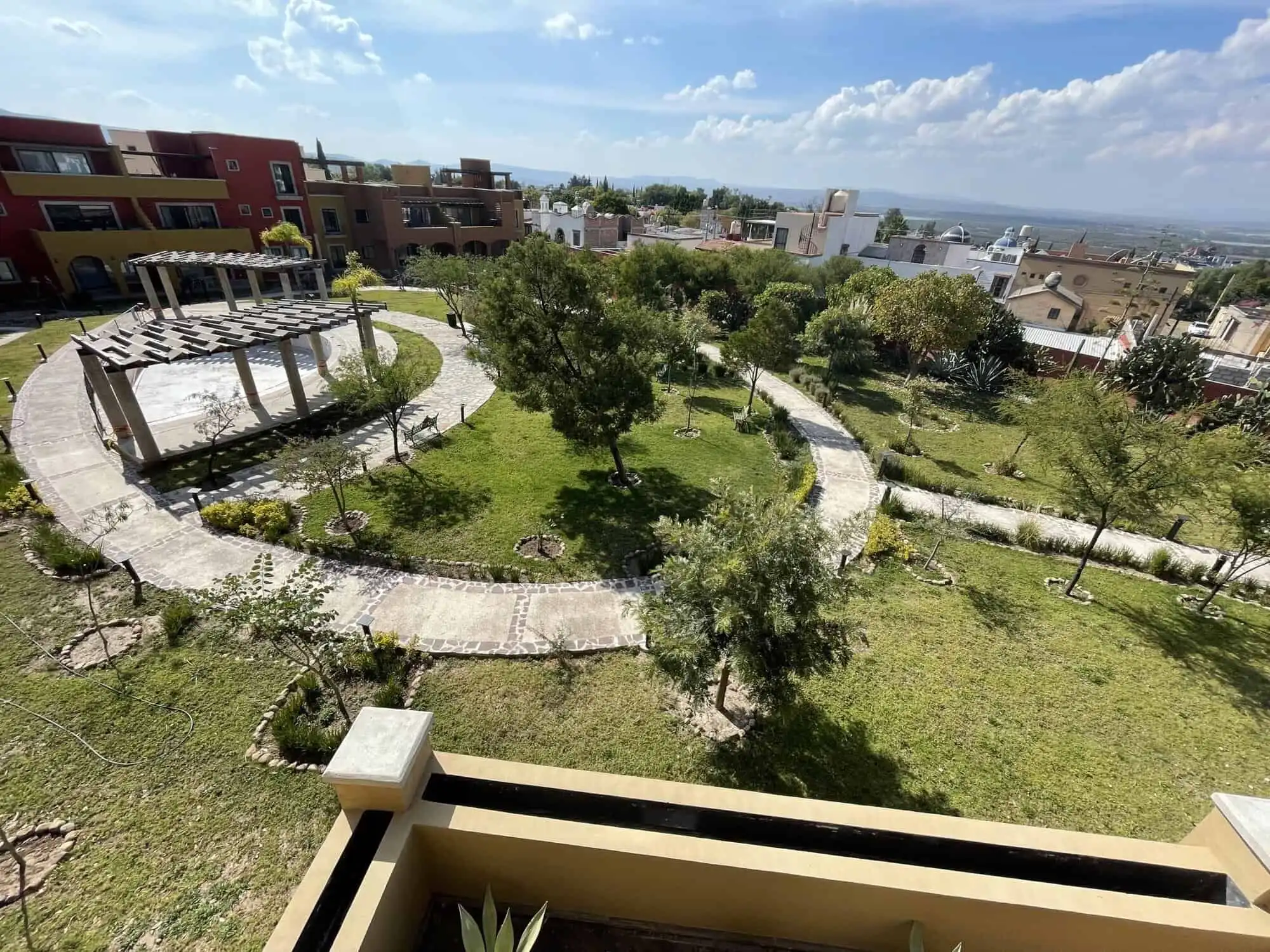 Beautiful garden with walking paths and lush greenery in Santo Domingo home.