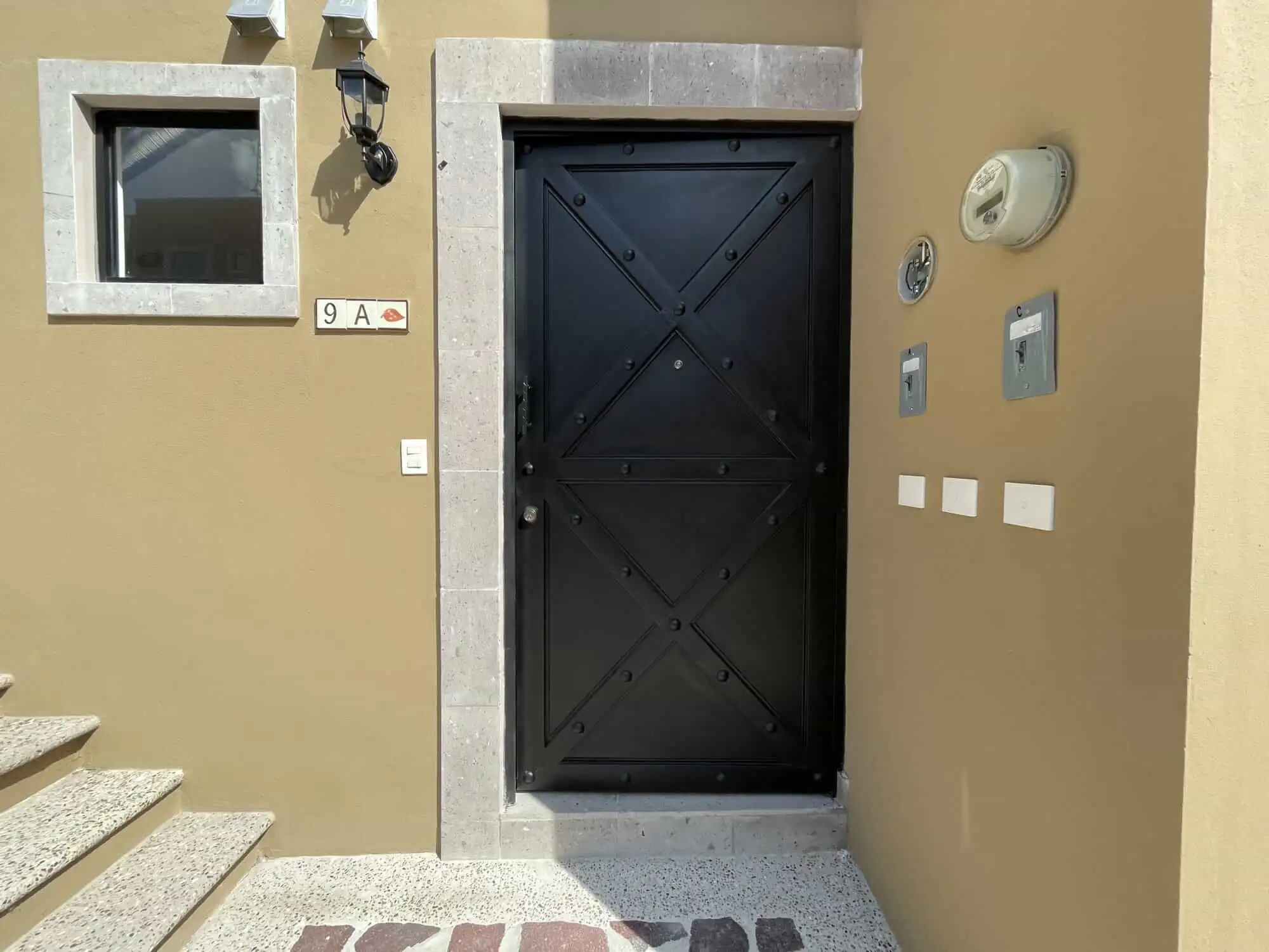 Elegant black door of a modern colonial-style house in La Serena, San Miguel de Allende.