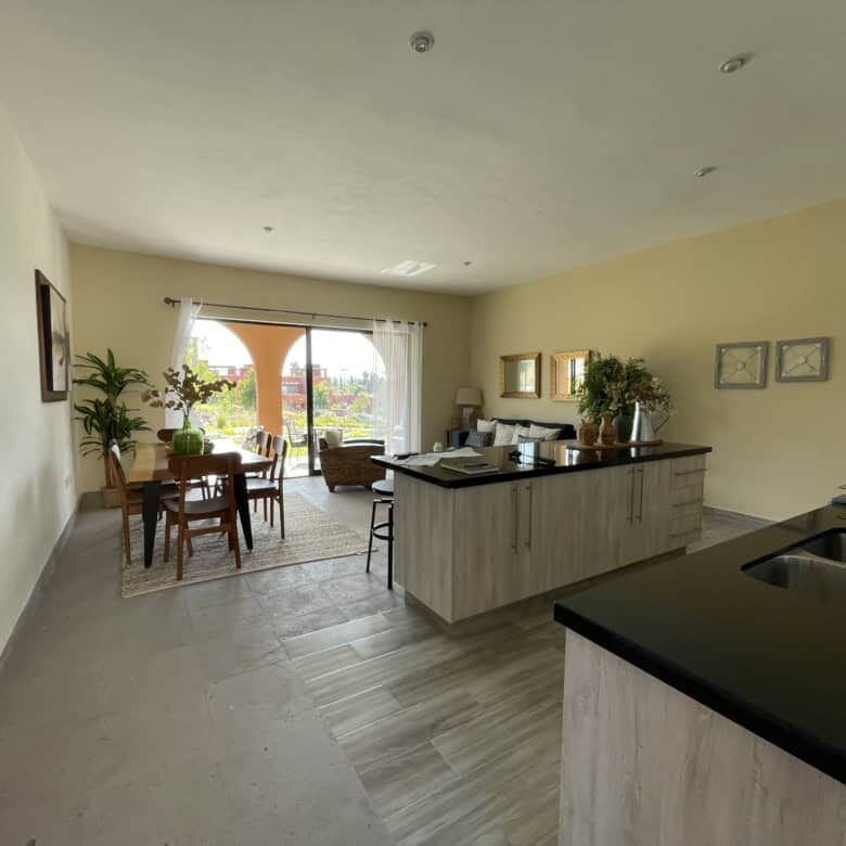 Spacious living area with open-plan kitchen and dining space in La Serena Residencial, San Miguel de.