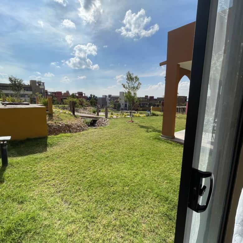 Beautiful green lawn with new construction homes in the background.