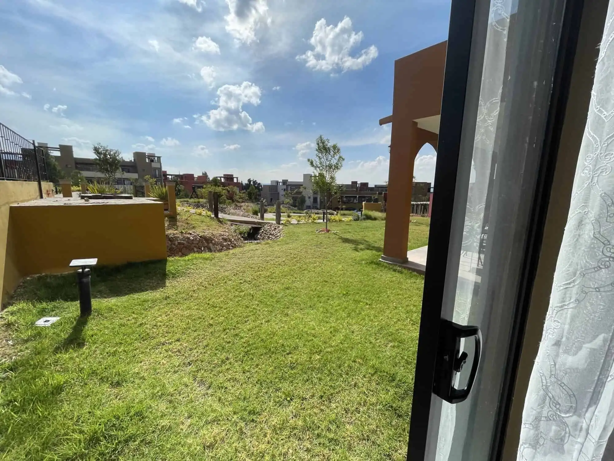 Beautiful green lawn with new construction homes in the background.