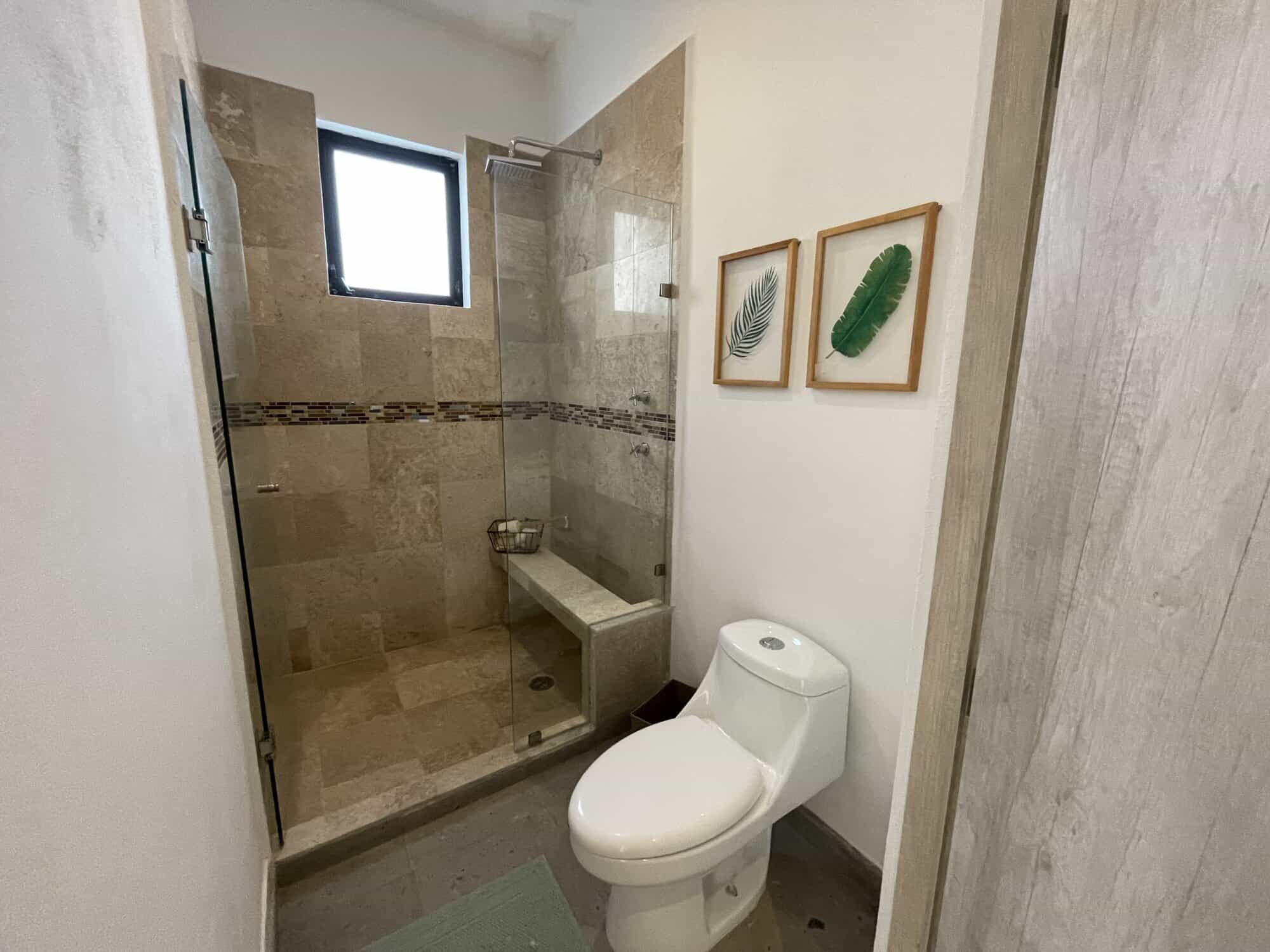Bathroom with walk-in shower and modern fixtures in La Serena Residencial, San Miguel de Allende.