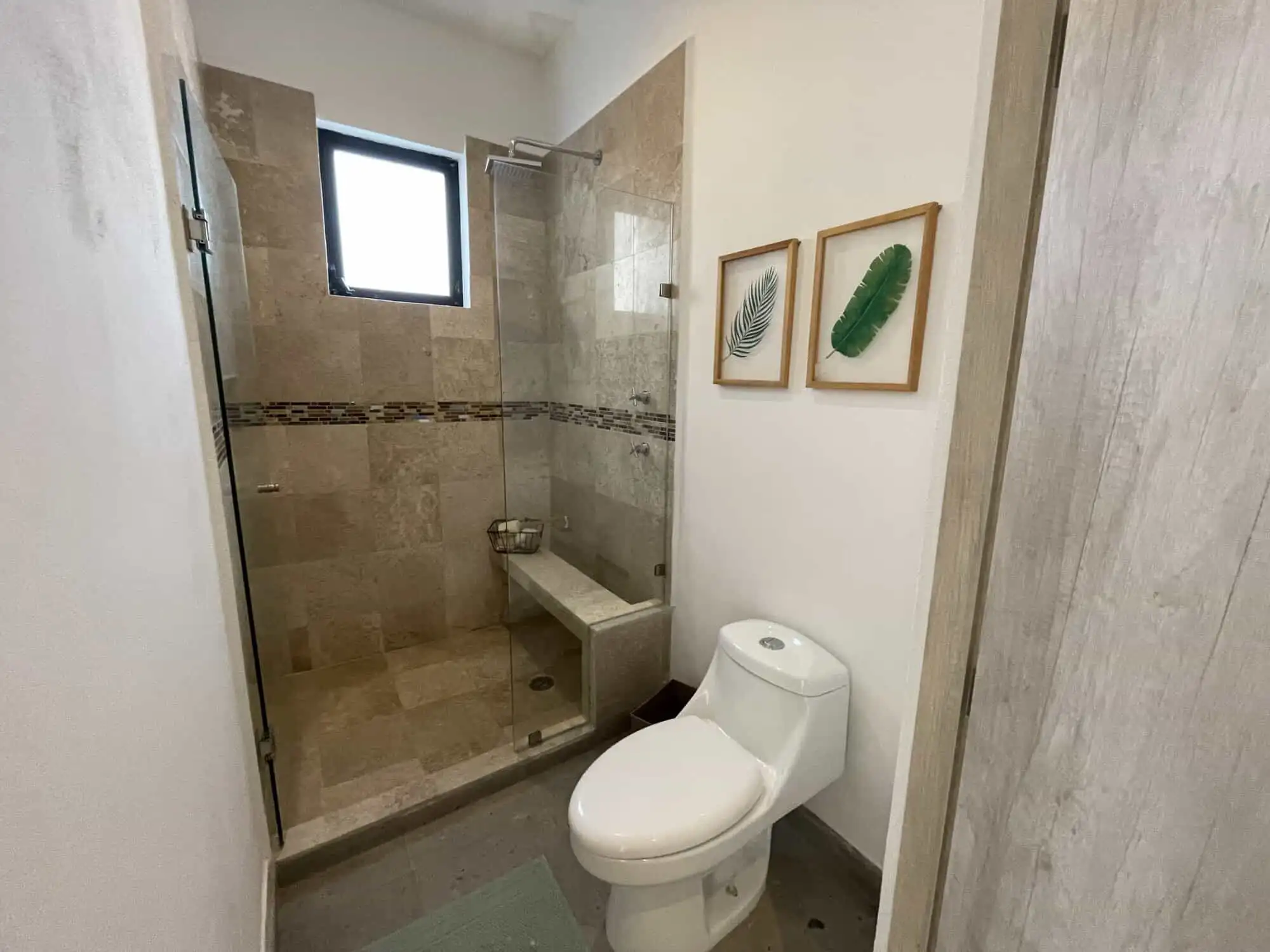Bathroom with walk-in shower and modern fixtures in La Serena Residencial, San Miguel de Allende.