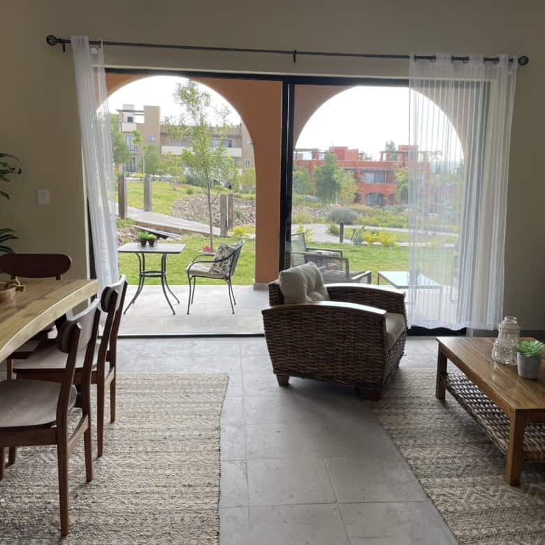 Spacious living area with comfortable seating and natural light.