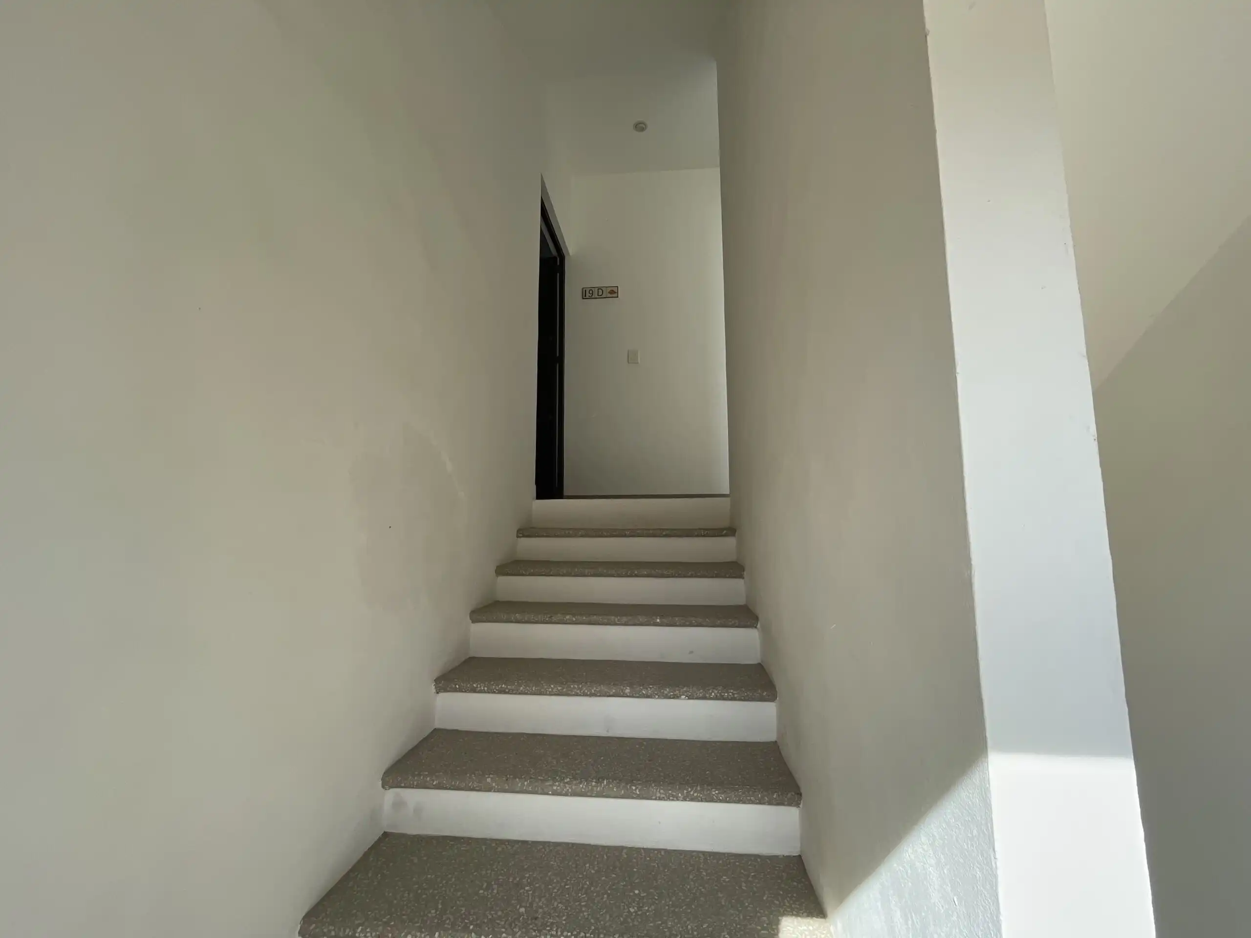 Interior view of a modern 2-bedroom apartment staircase in La Serena Residencial.