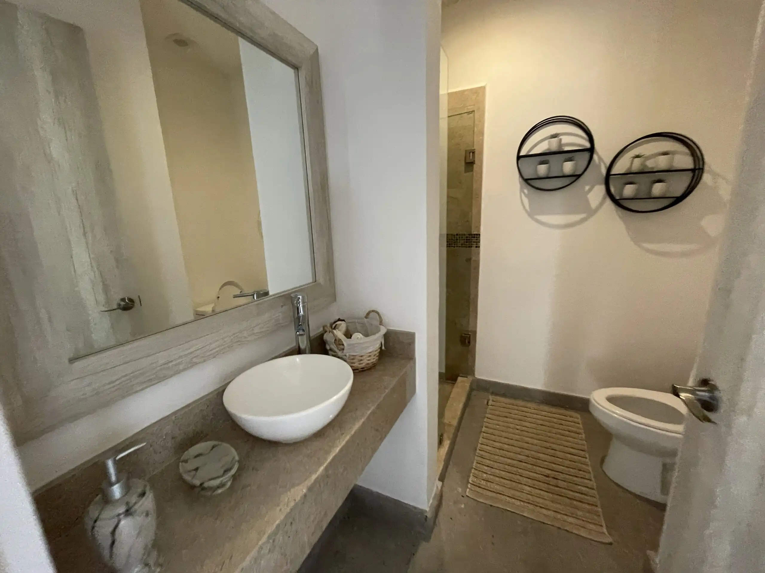 Interior view of a modern 2-bedroom apartment bathroom in La Serena Residencial, San Miguel de Allen.