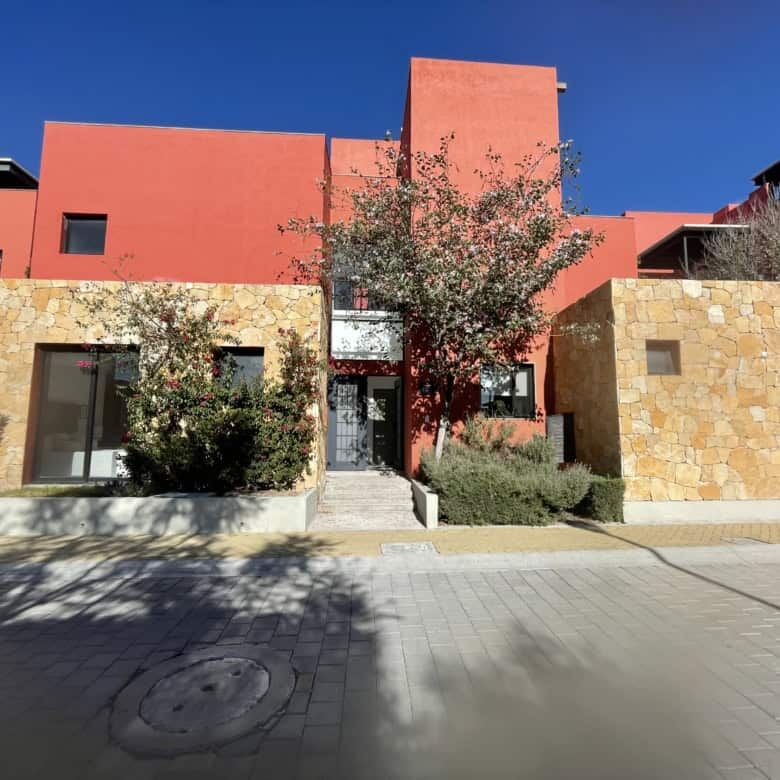 Elegant 4-bedroom residence with rooftop terraces and resort-style amenities.