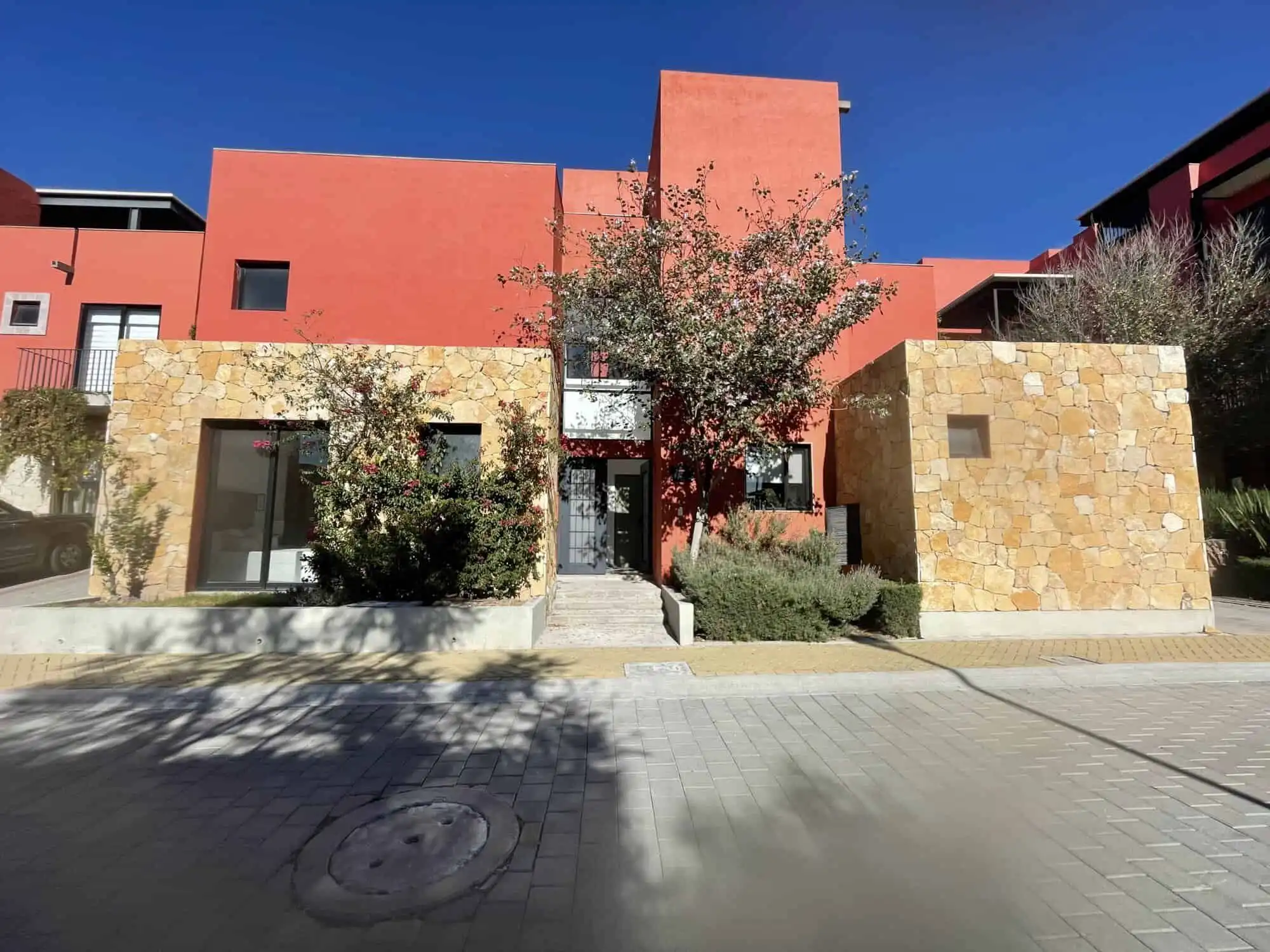 Elegant 4-bedroom residence with rooftop terraces and resort-style amenities.