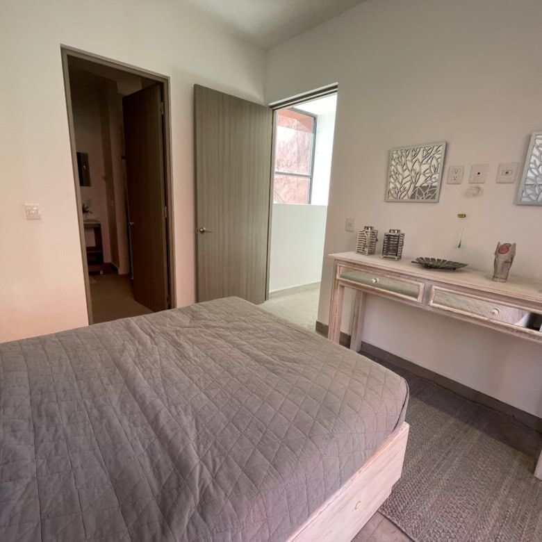 Spacious bedroom with modern decor and natural light in a luxury home in Punta de Cielo.