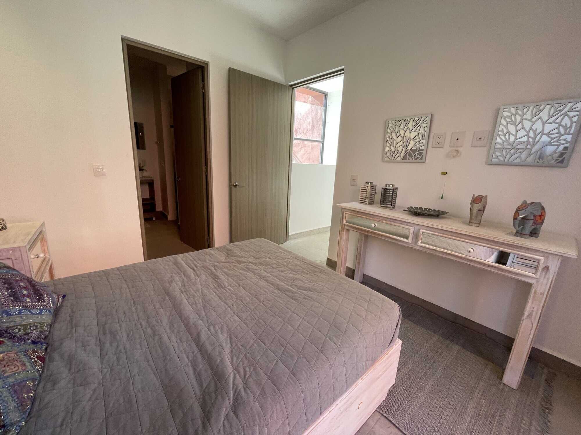 Spacious bedroom with modern decor and natural light in a luxury home in Punta de Cielo.