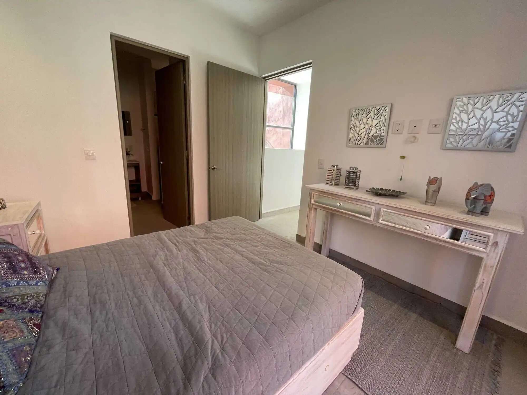 Spacious bedroom with modern decor and natural light in a luxury home in Punta de Cielo.