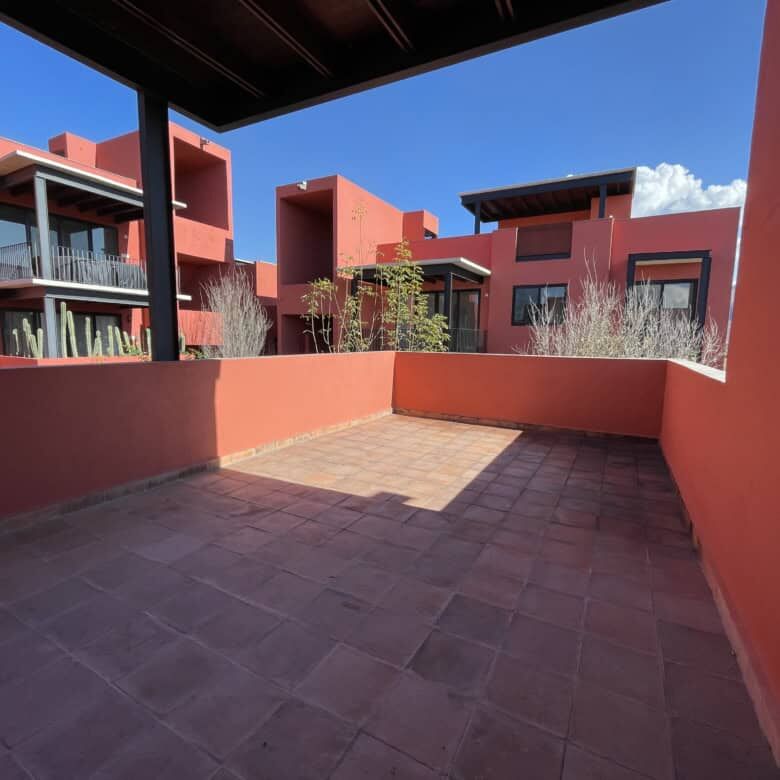 Spacious rooftop terrace with vibrant red building views in Punta de Cielo, San Miguel de Allende.