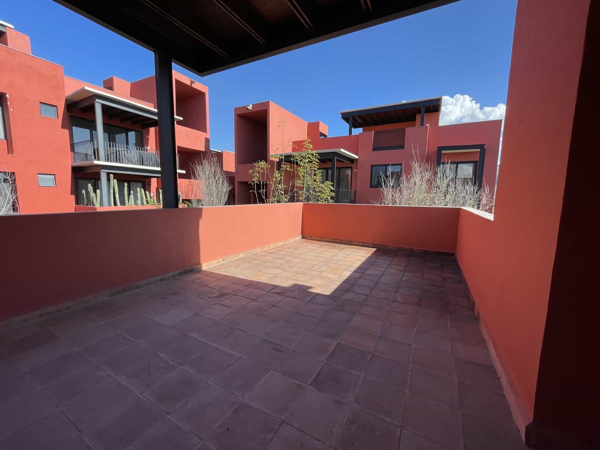 Spacious rooftop terrace with vibrant red building views in Punta de Cielo, San Miguel de Allende.