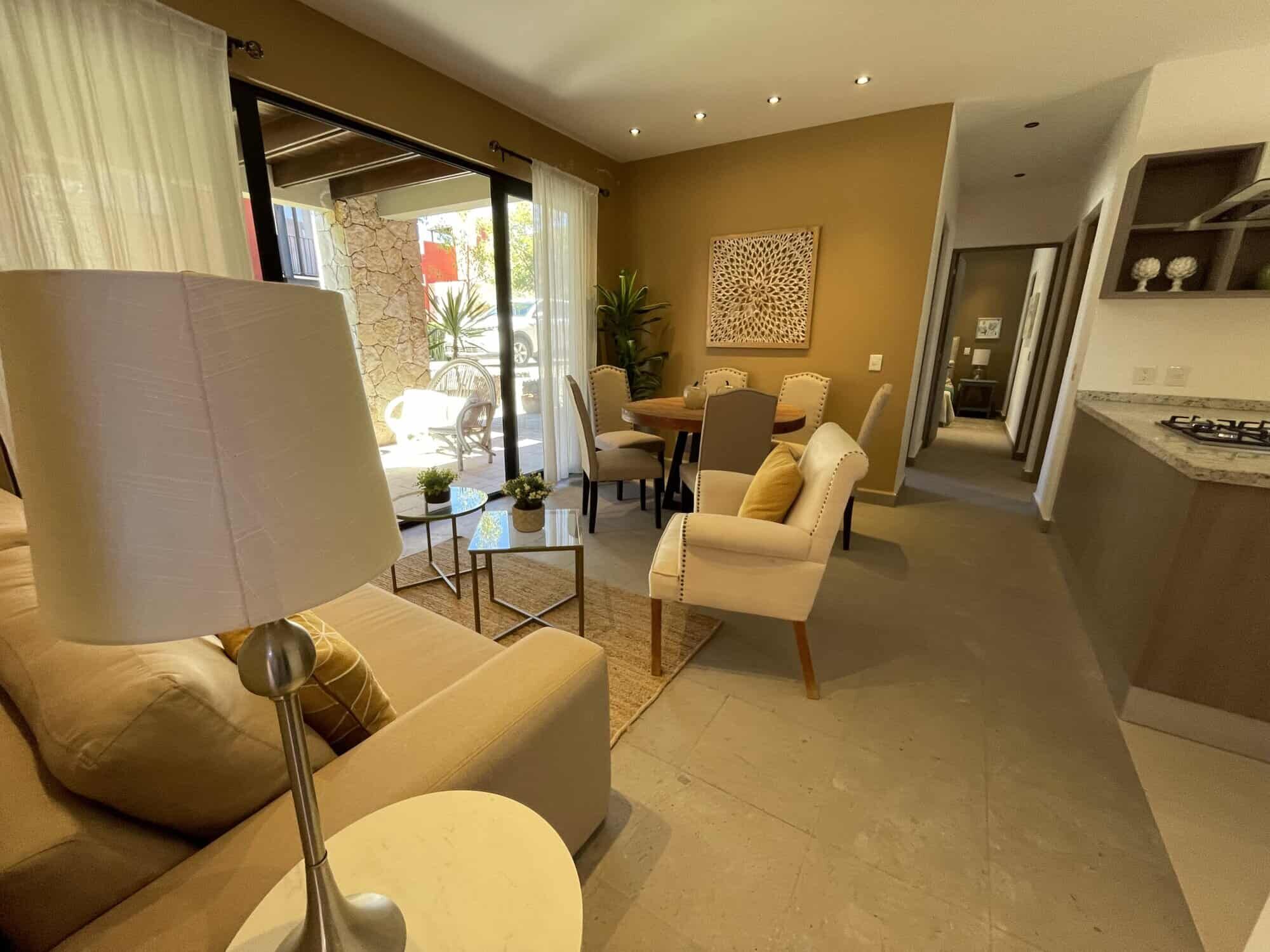 Spacious living room with natural light, stylish furniture, and access to outdoor patio. Perfect for.