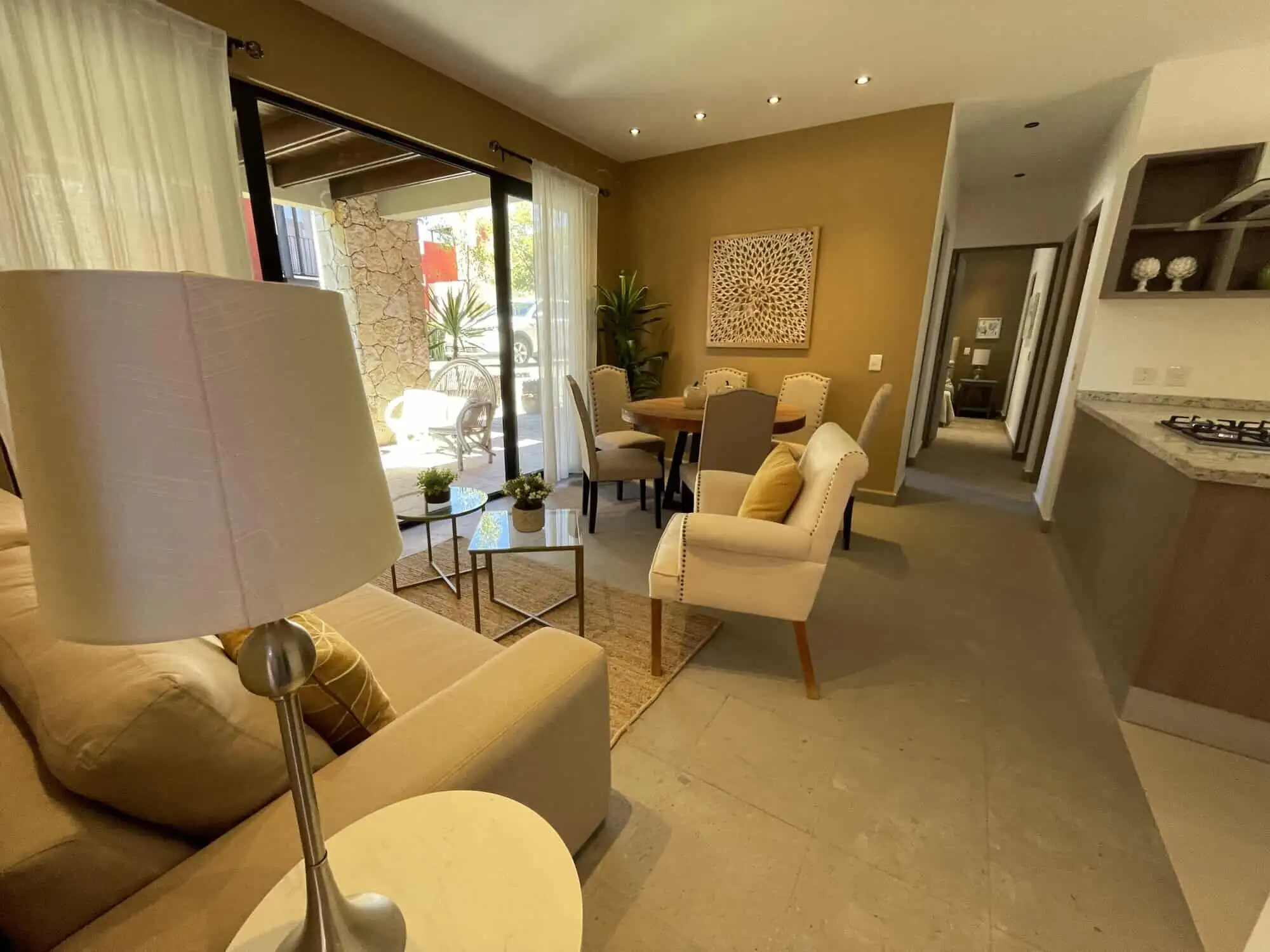 Spacious living room with natural light, stylish furniture, and access to outdoor patio. Perfect for.