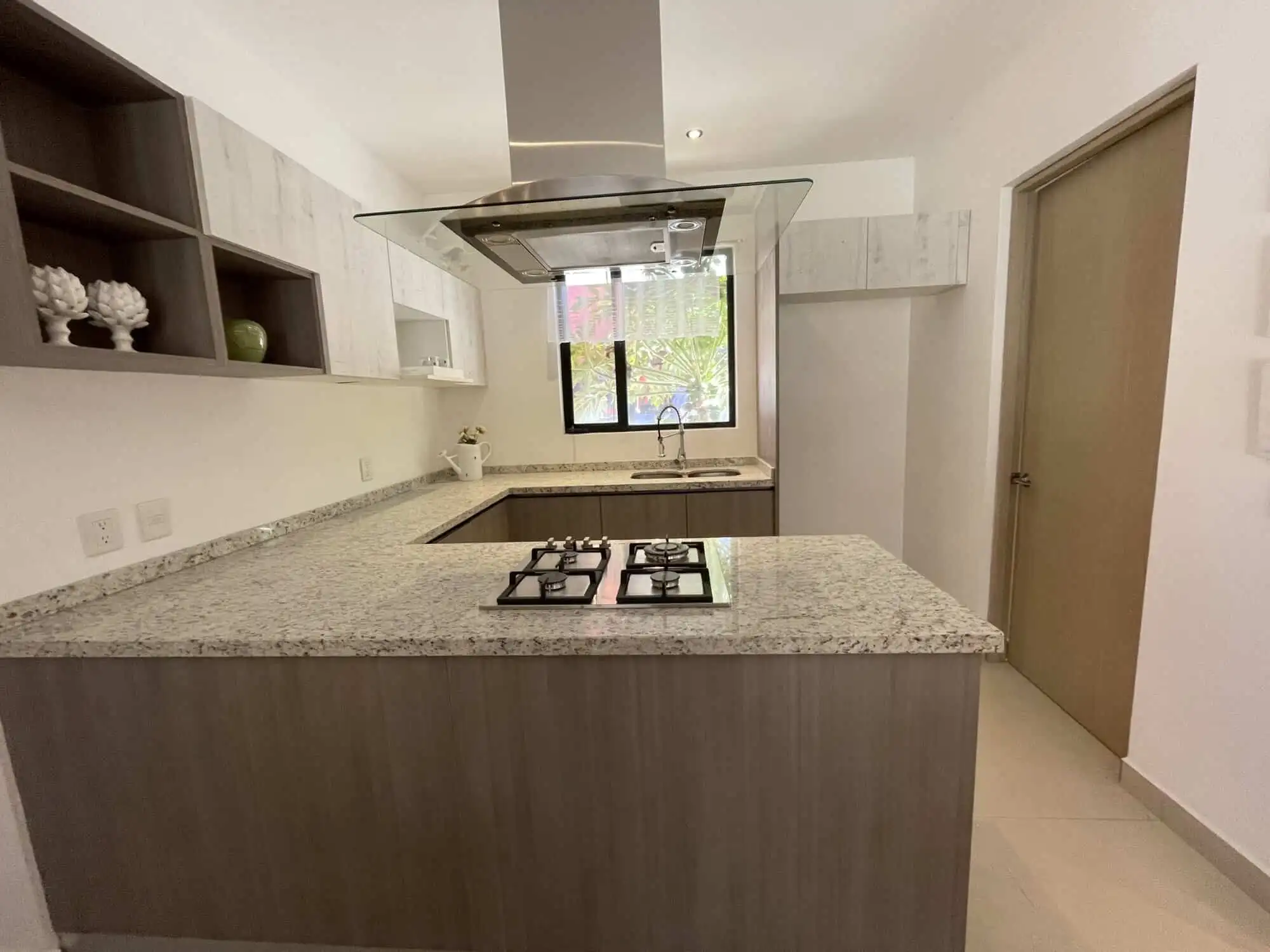 Bright, airy kitchen with granite countertops and ample storage space. Perfect for comfortable livin.