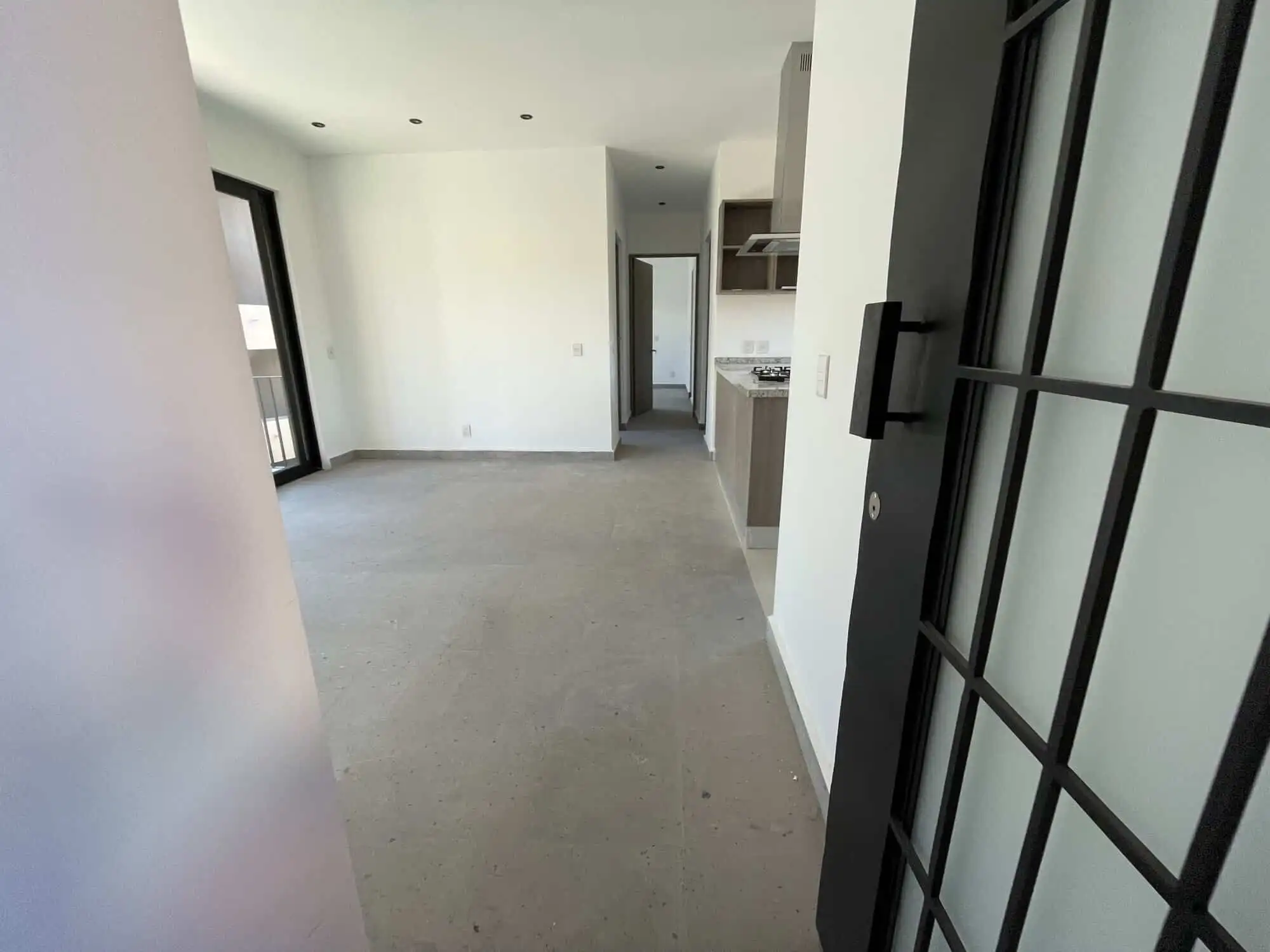 Modern Penthouse Living with Rooftop View Bright, open-concept interior of a penthouse condo in San Miguel de Allende.