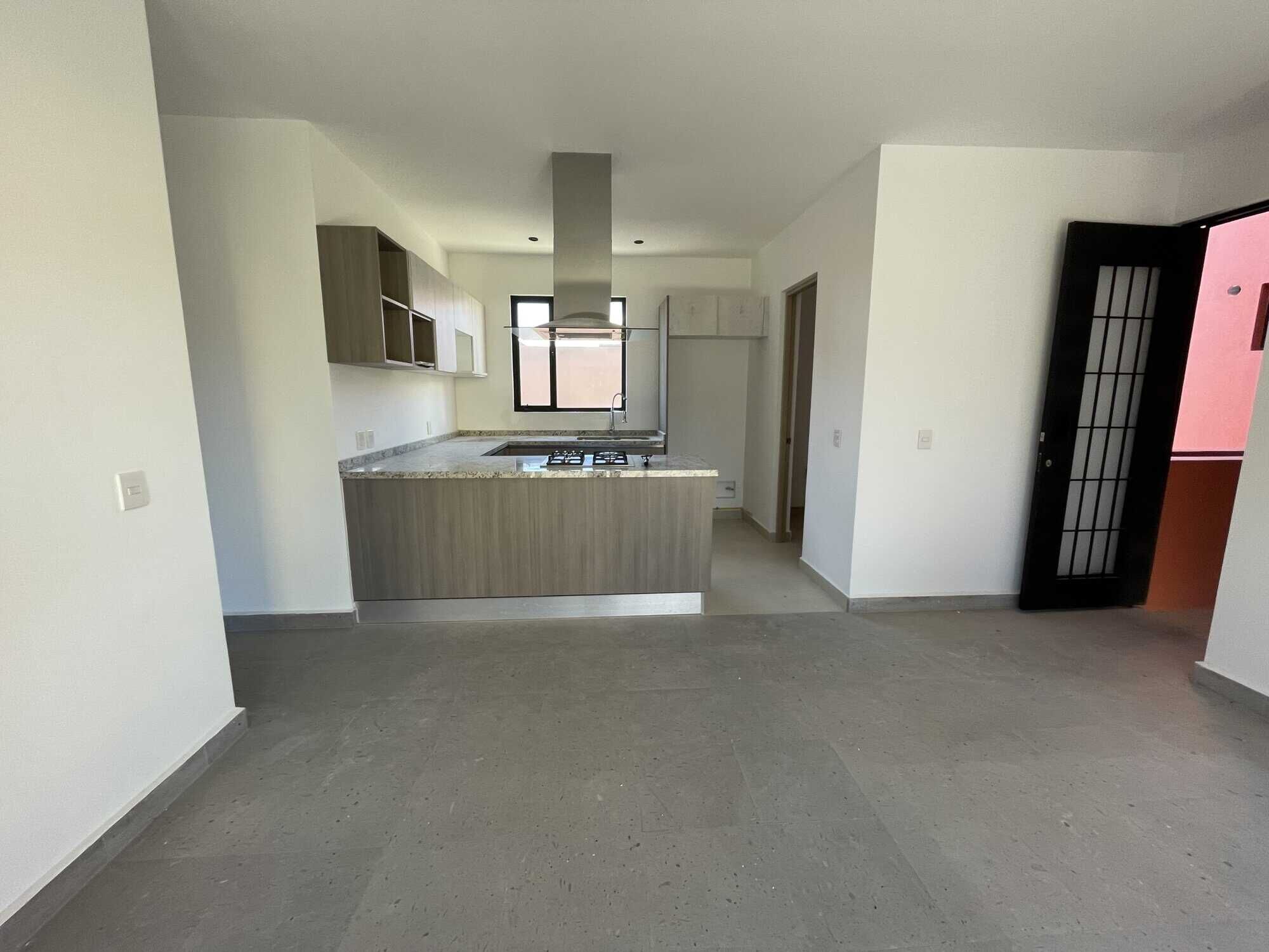 Spacious interior of a penthouse condo with contemporary kitchen and bright living area in San Migue.