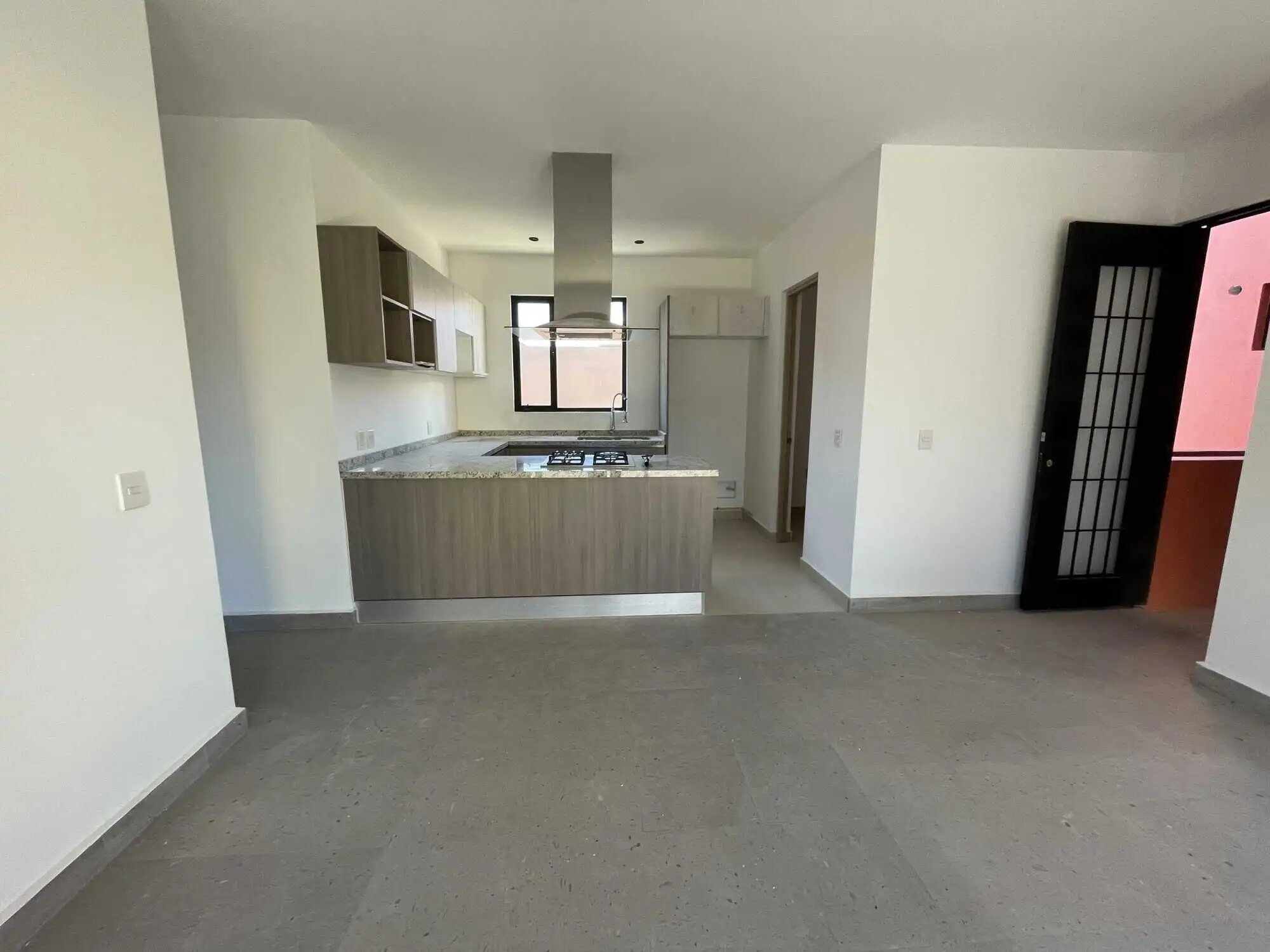 concept kitchen and living space in San Miguel de Allende Spacious interior of a penthouse condo with contemporary kitchen and bright living area in San Migue.