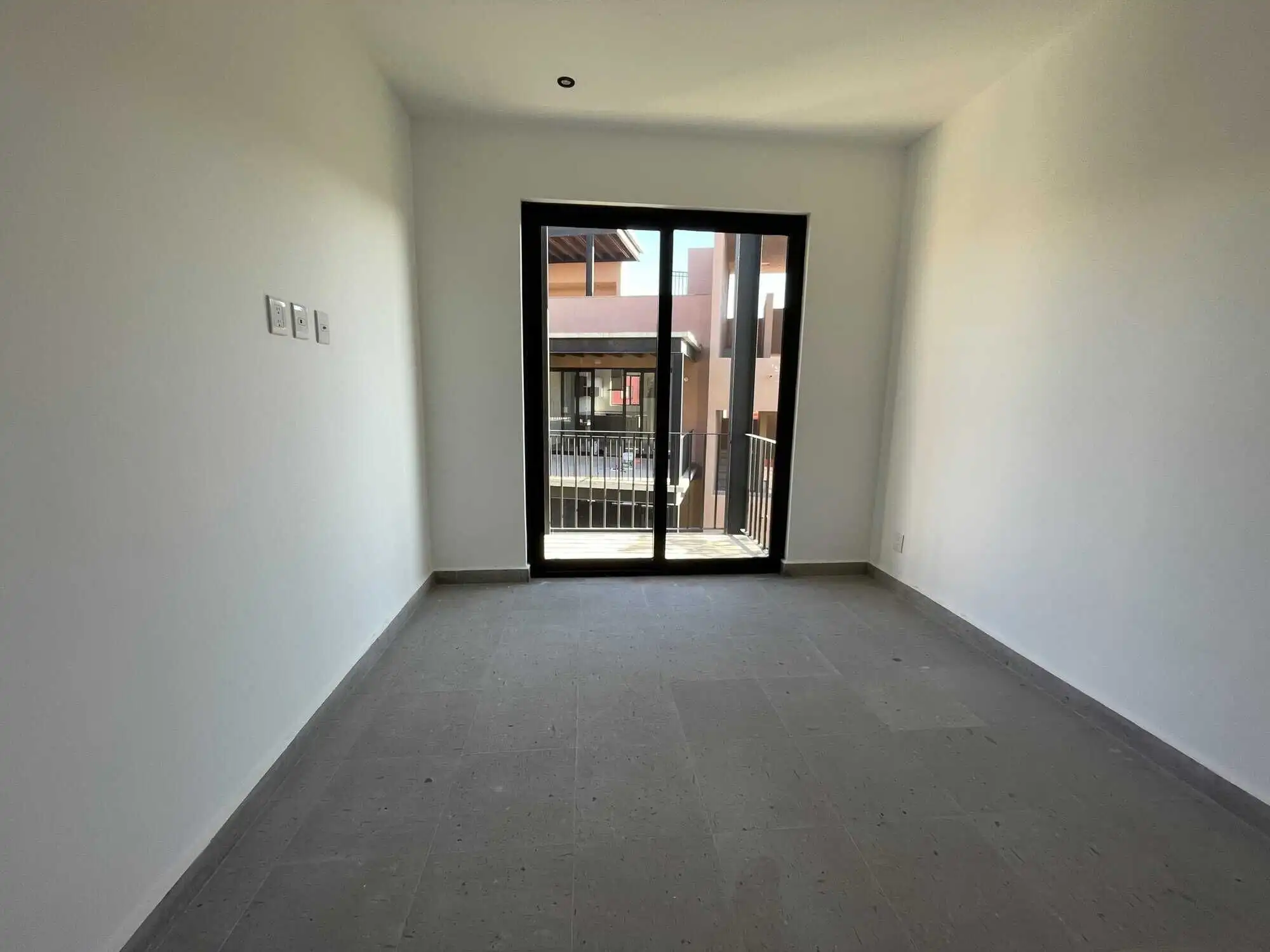 Modern interior room with balcony access in a penthouse condo. Modern interior room with balcony access in a penthouse condo.